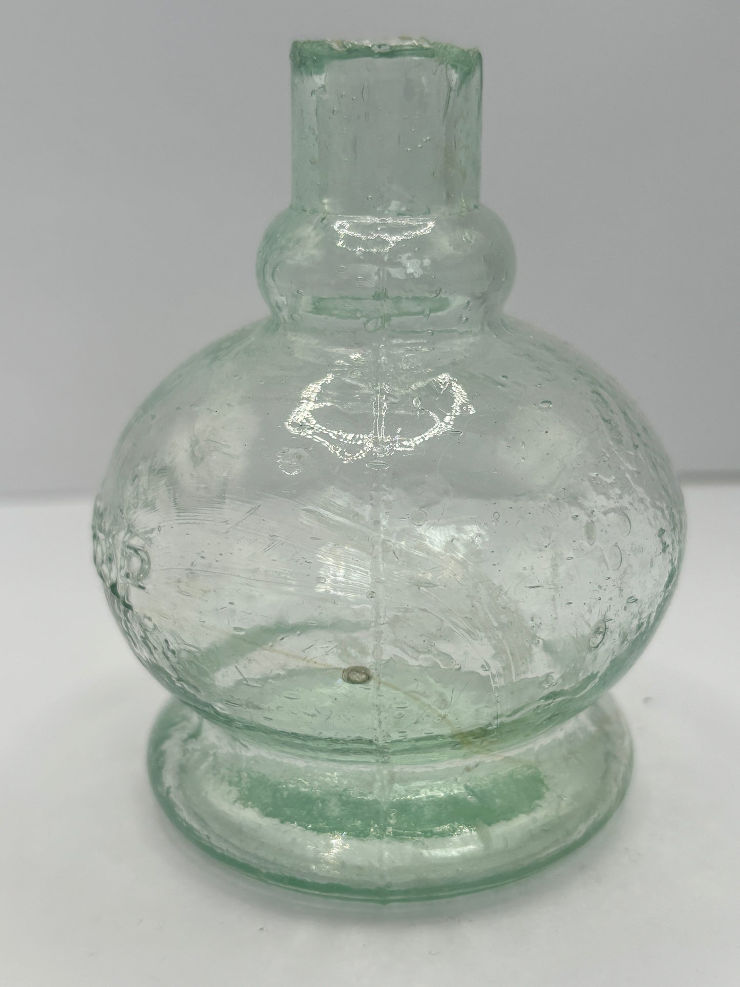 Small aqua glass oil lamp. The Lamp