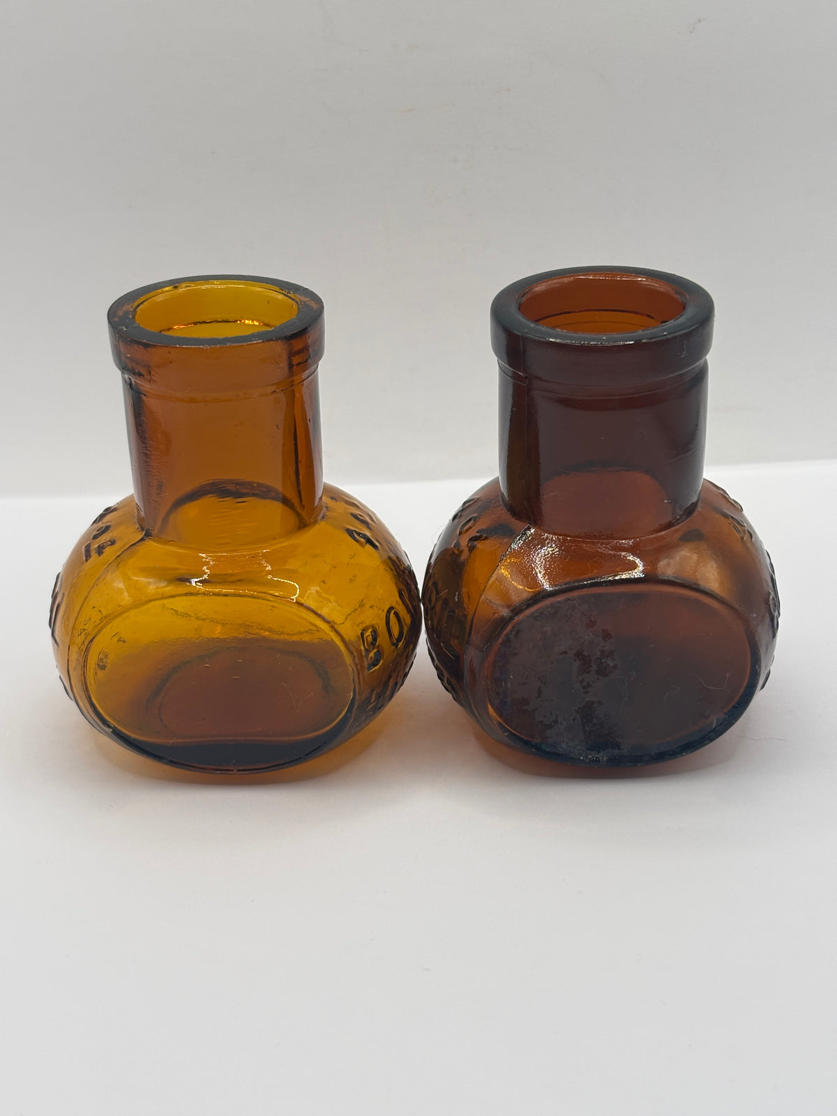 2 old 4Oz amber glass advertising Bovril bottles