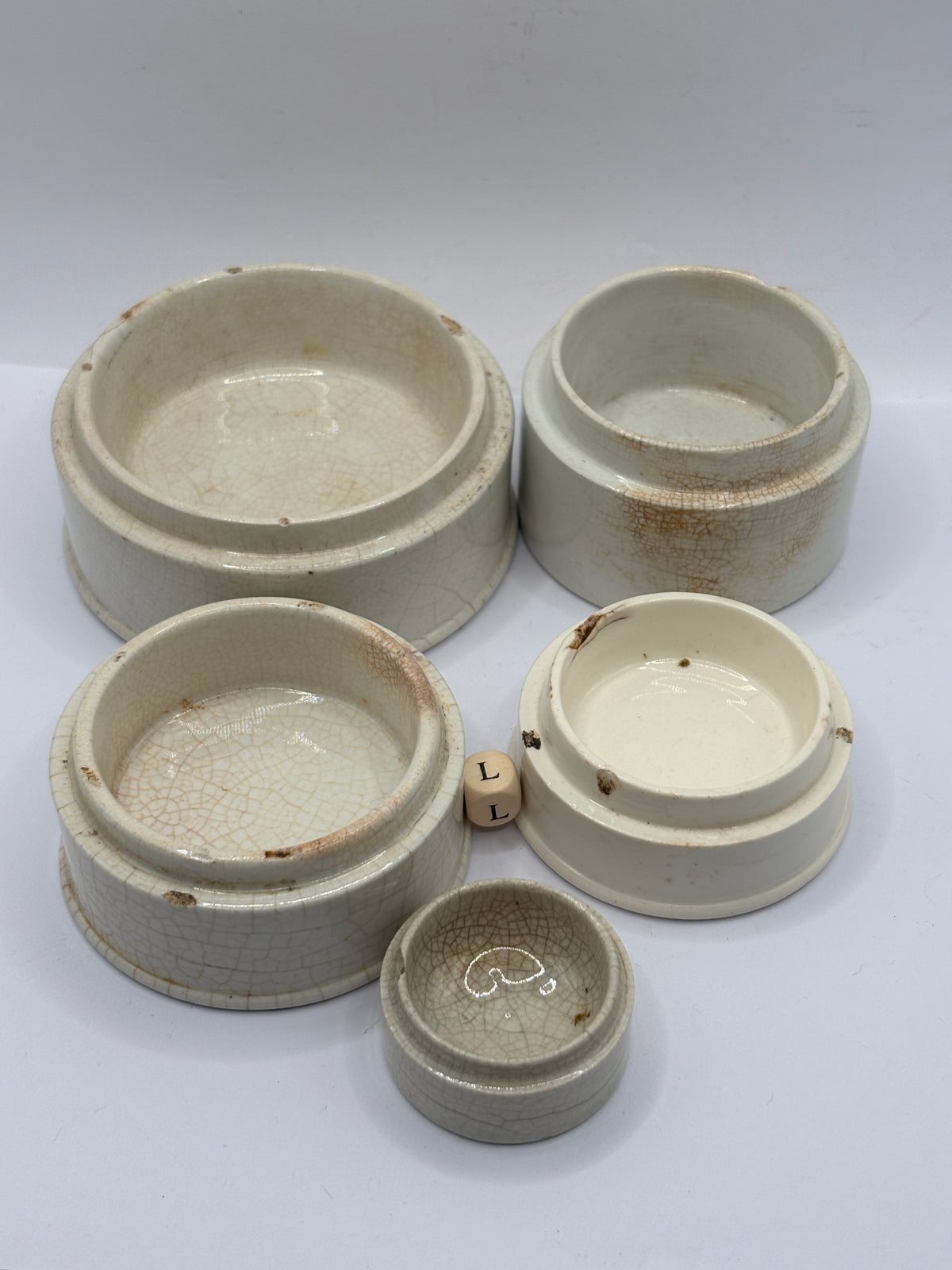 5 old stoneware pot lid bases, stackers (L)