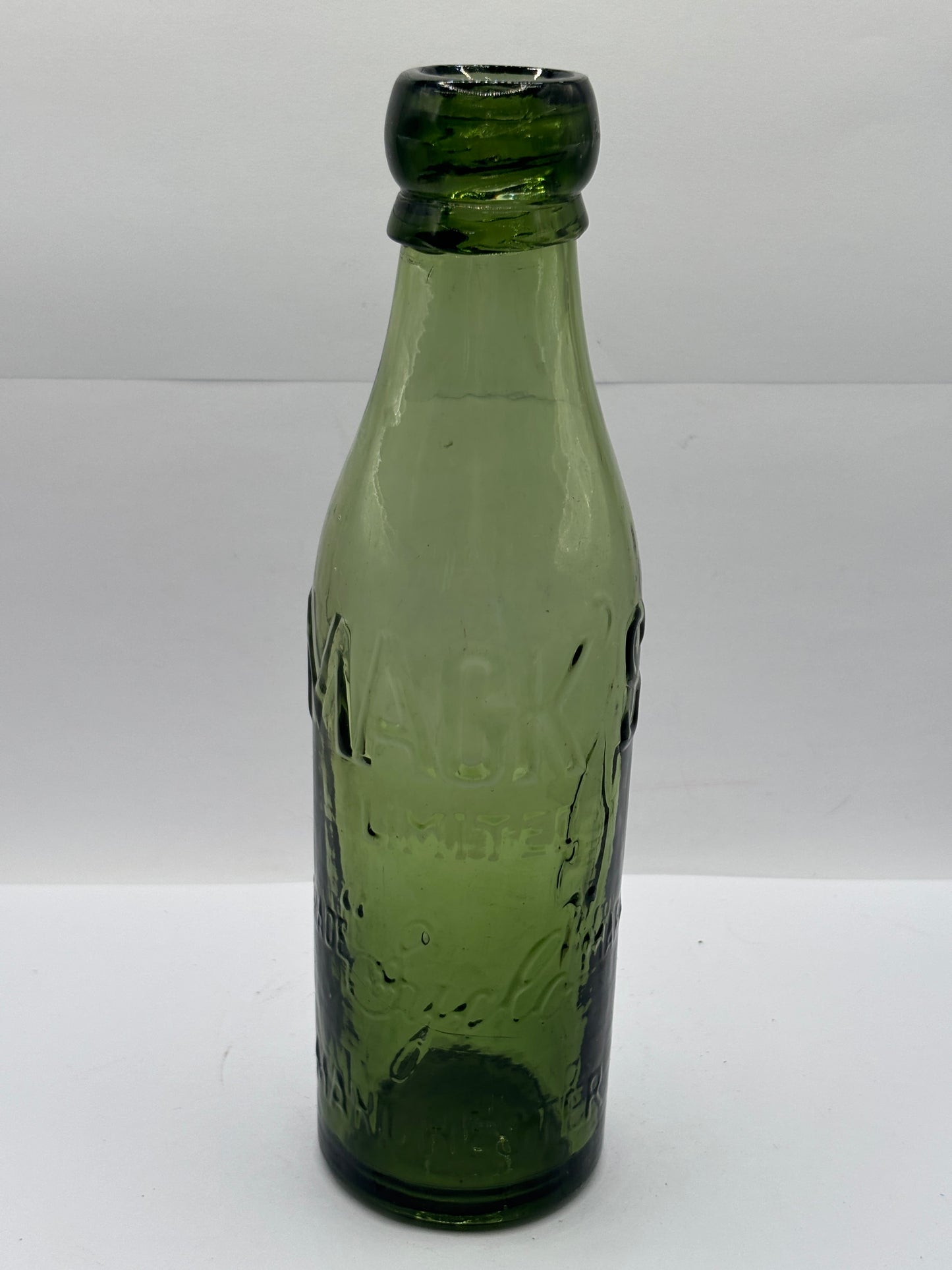 Old advertising green glass beer bottle, Macks Manchester
