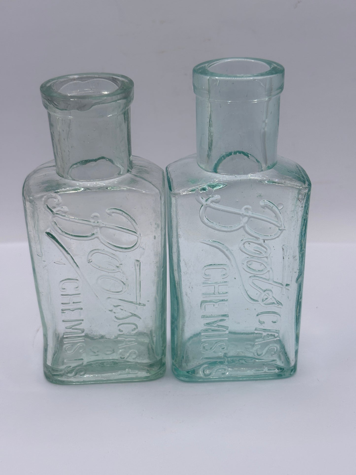 2 Old glass Boots cash chemists bottles