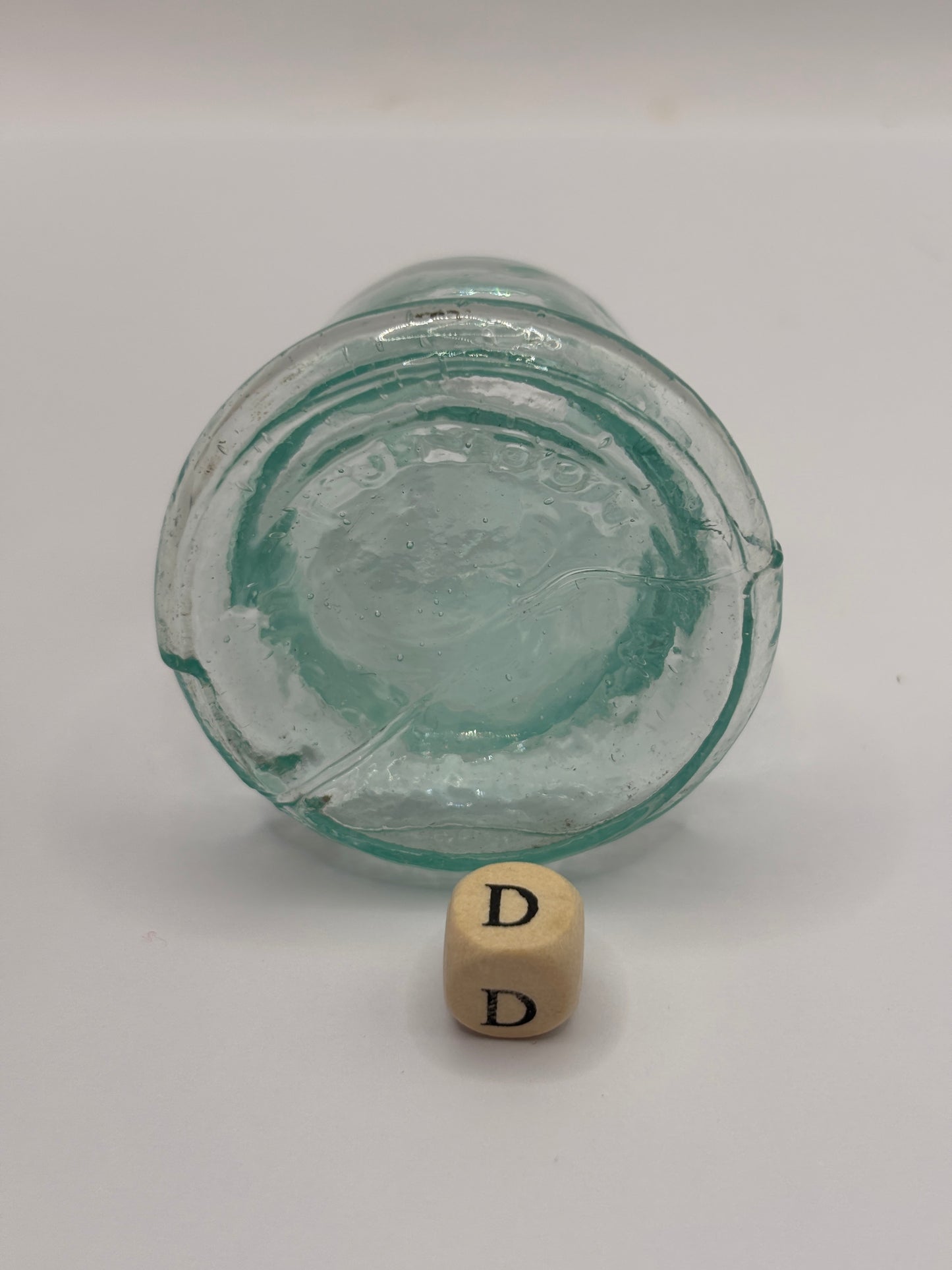 Old aqua glass inkwell, Bell ink (D)