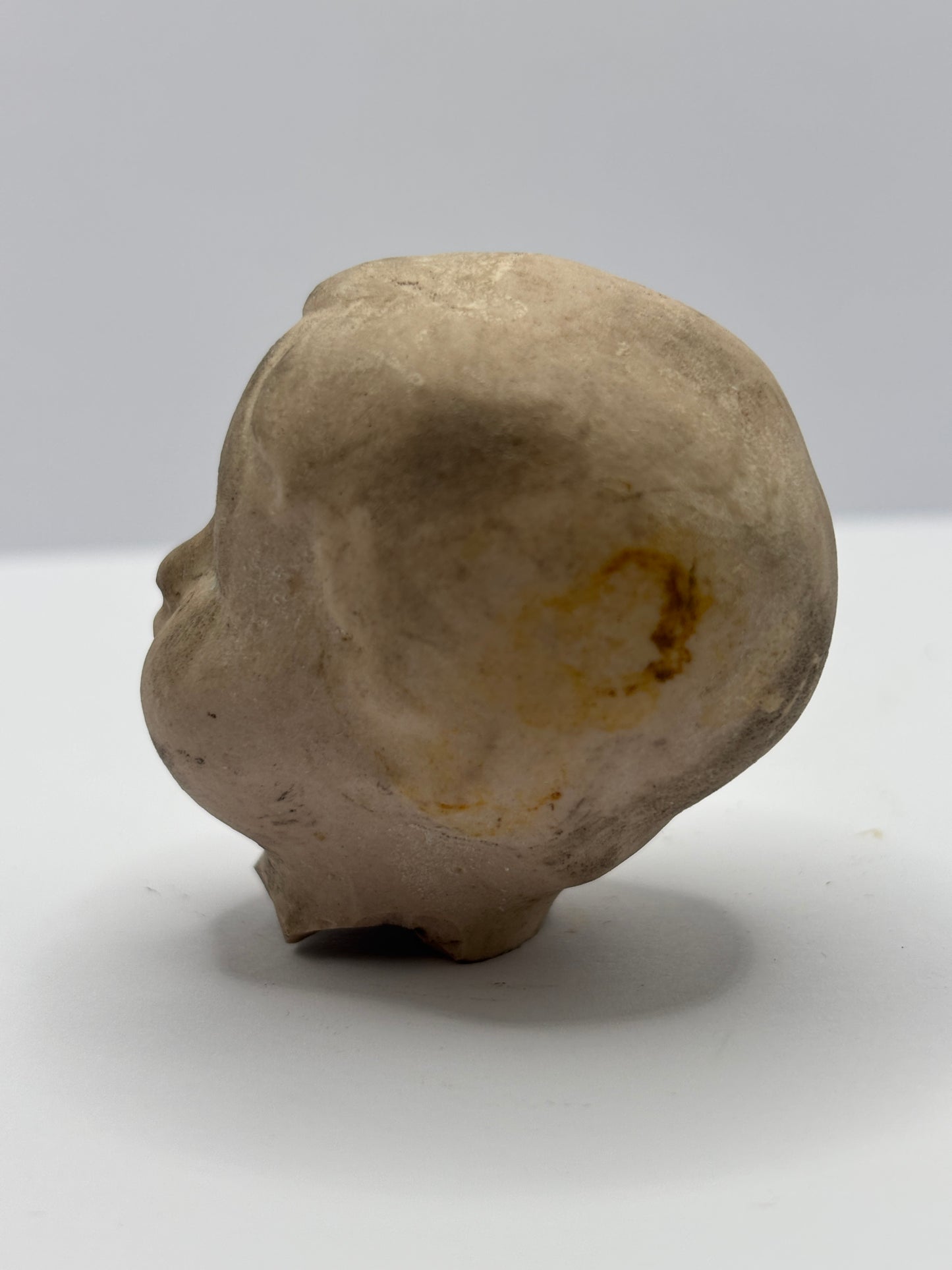 Old damaged dolls head