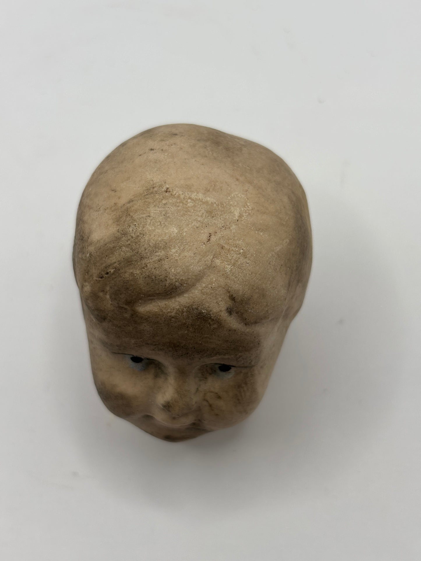 Old damaged dolls head