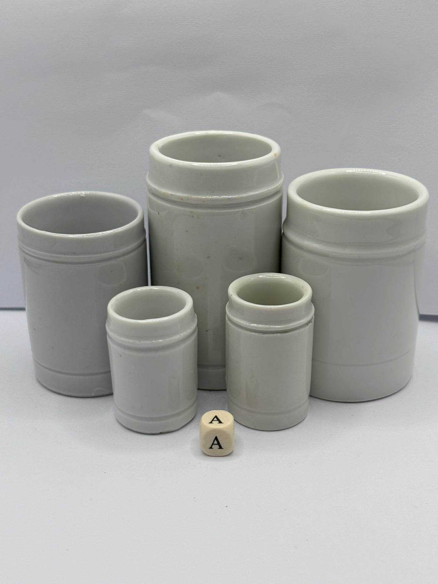 5 small white stoneware pots (A)