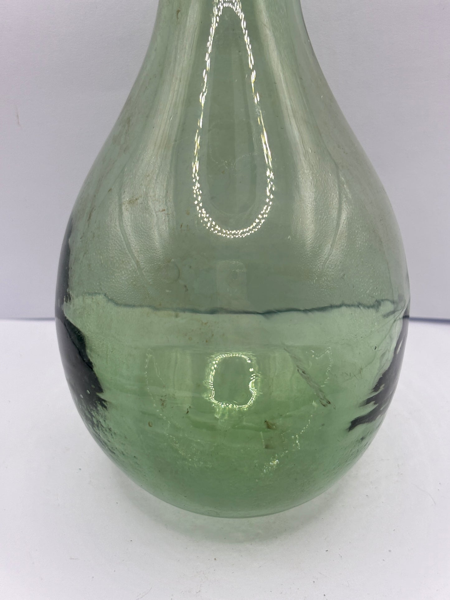 Old round bottom aqua glass bottle