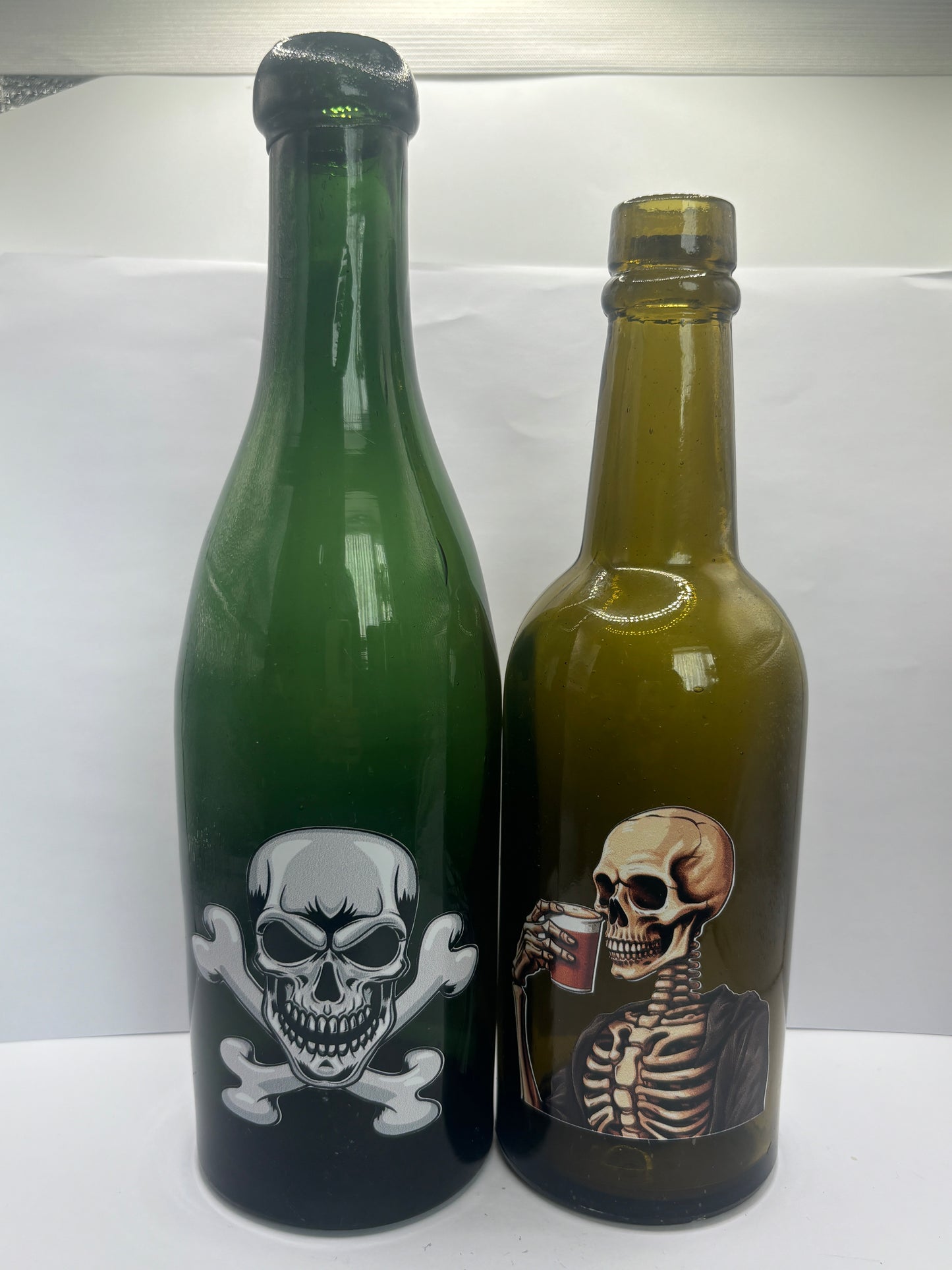 2 labelled halloween bottles