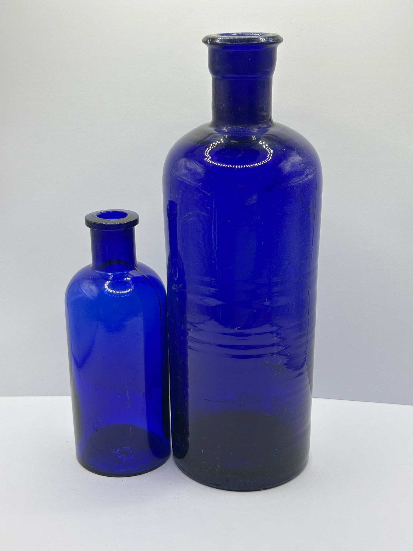 2 old large blue poison/chemist bottles