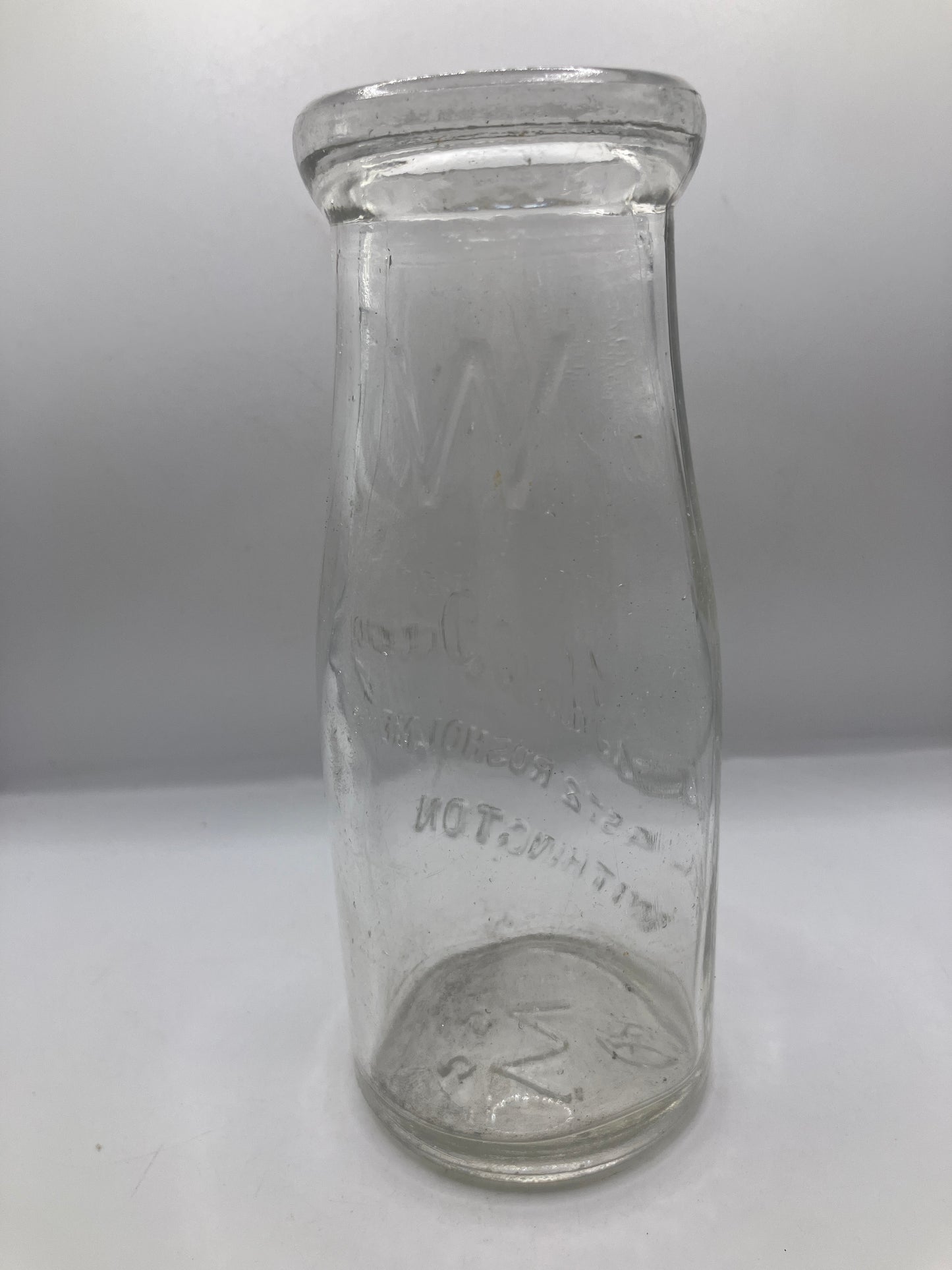 Advertising milk bottle, whites ideal dairy