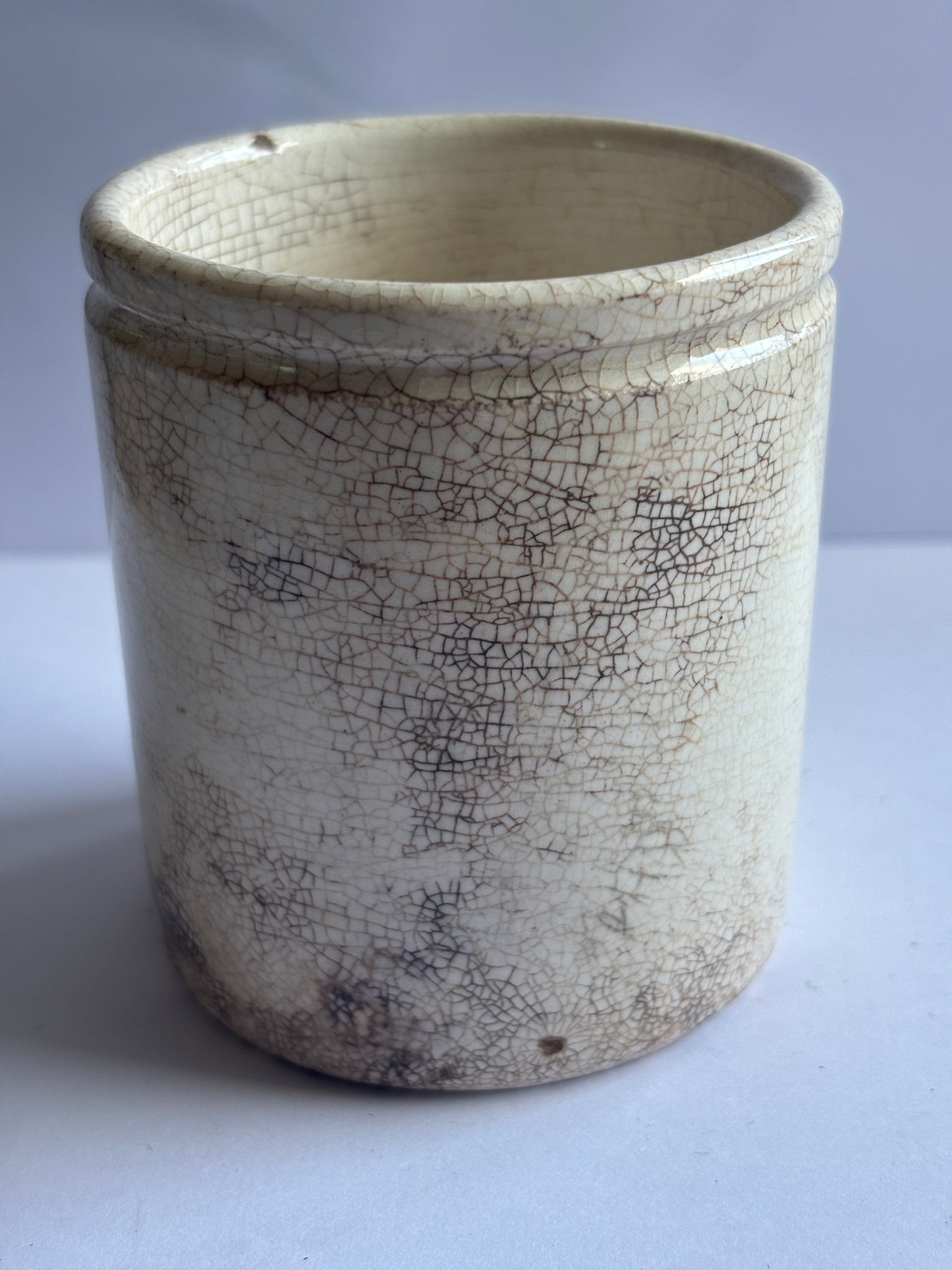 Old white stoneware pot, stained & crazed