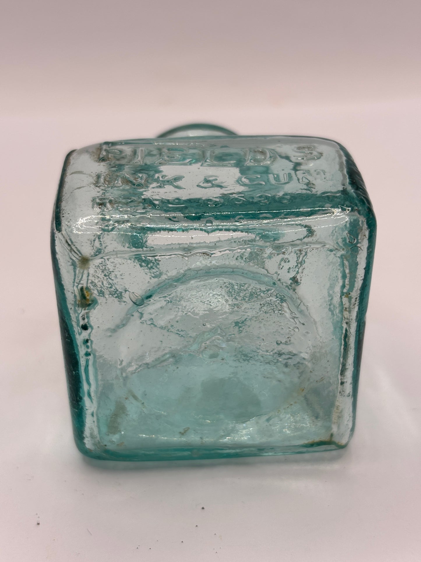 Old aqua glass advertising inkwell, ink bottle. Fields ink