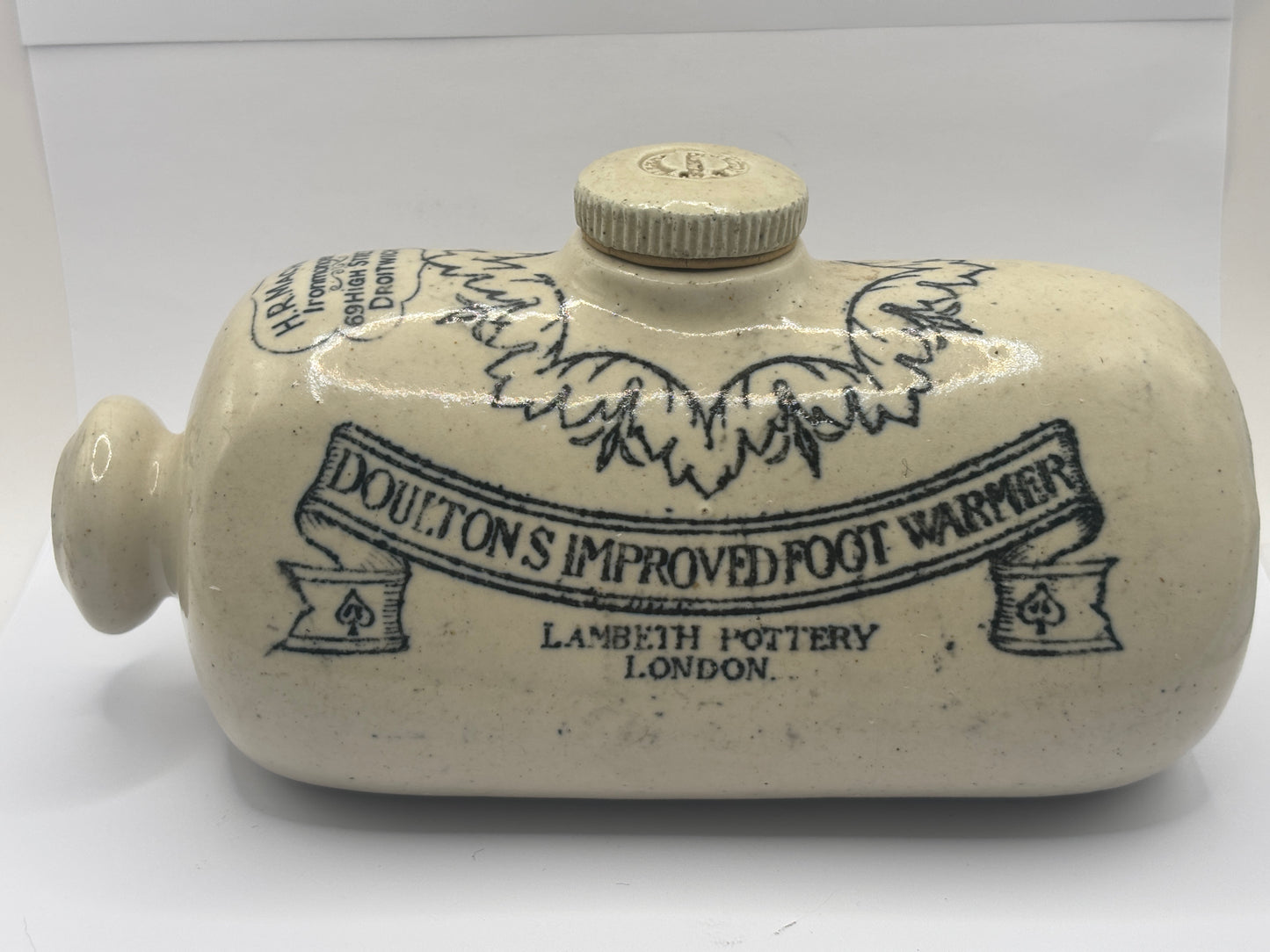 Old Doultons advertising footwarmer. Doultons improved foot warmer