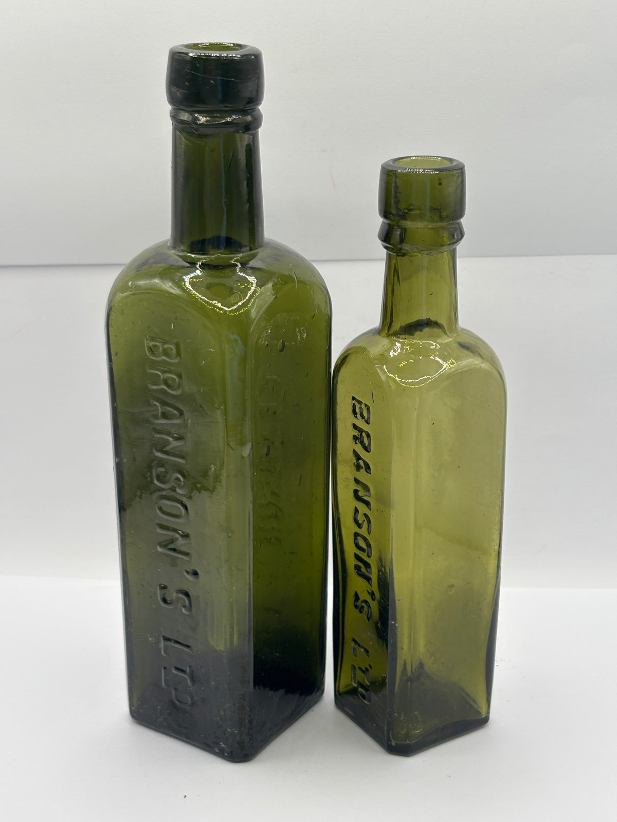 2 Old green glass Branston sauce bottles