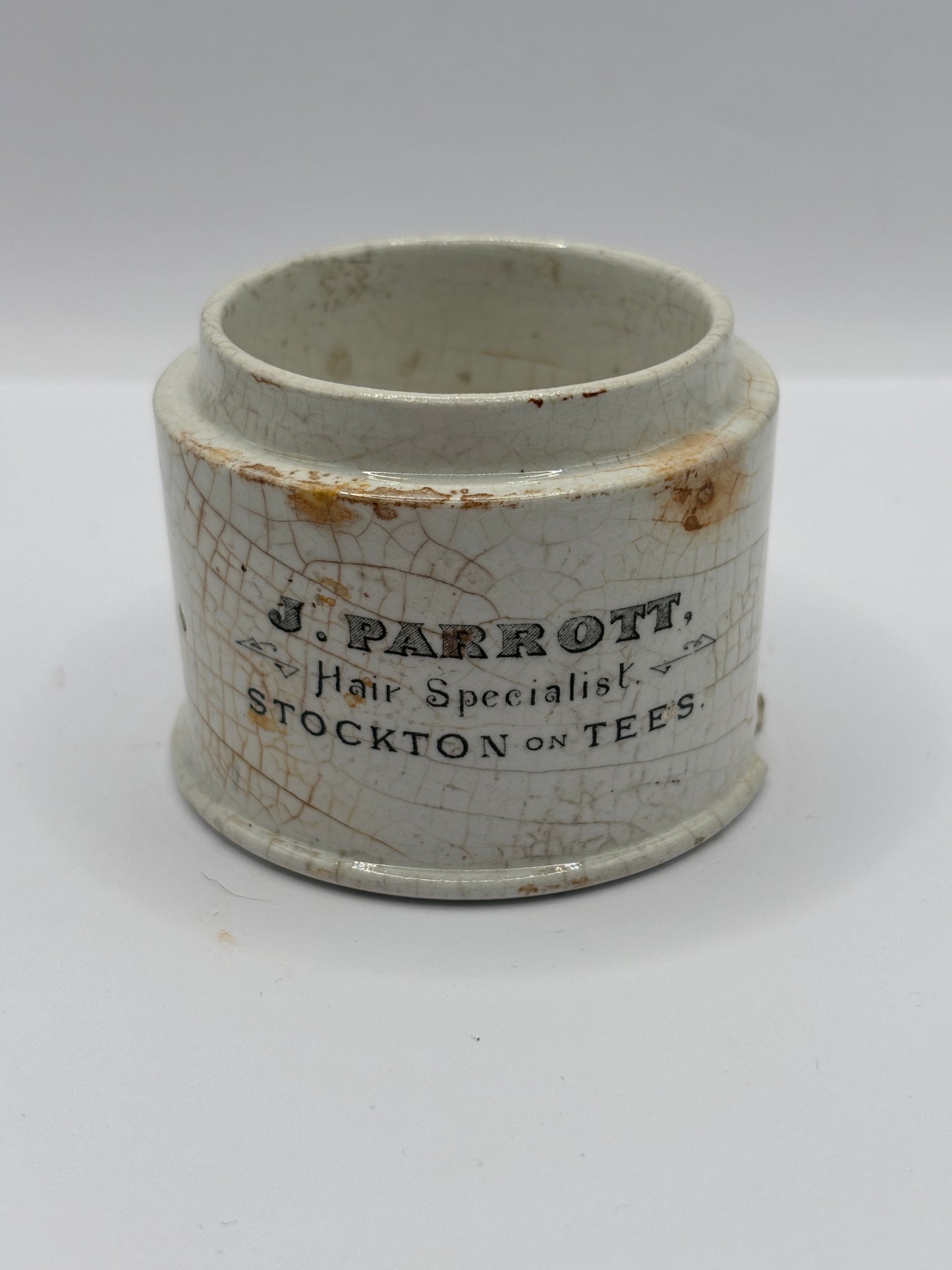 Old advertising base, J.Parrott Hair Specialists stockton on tees
