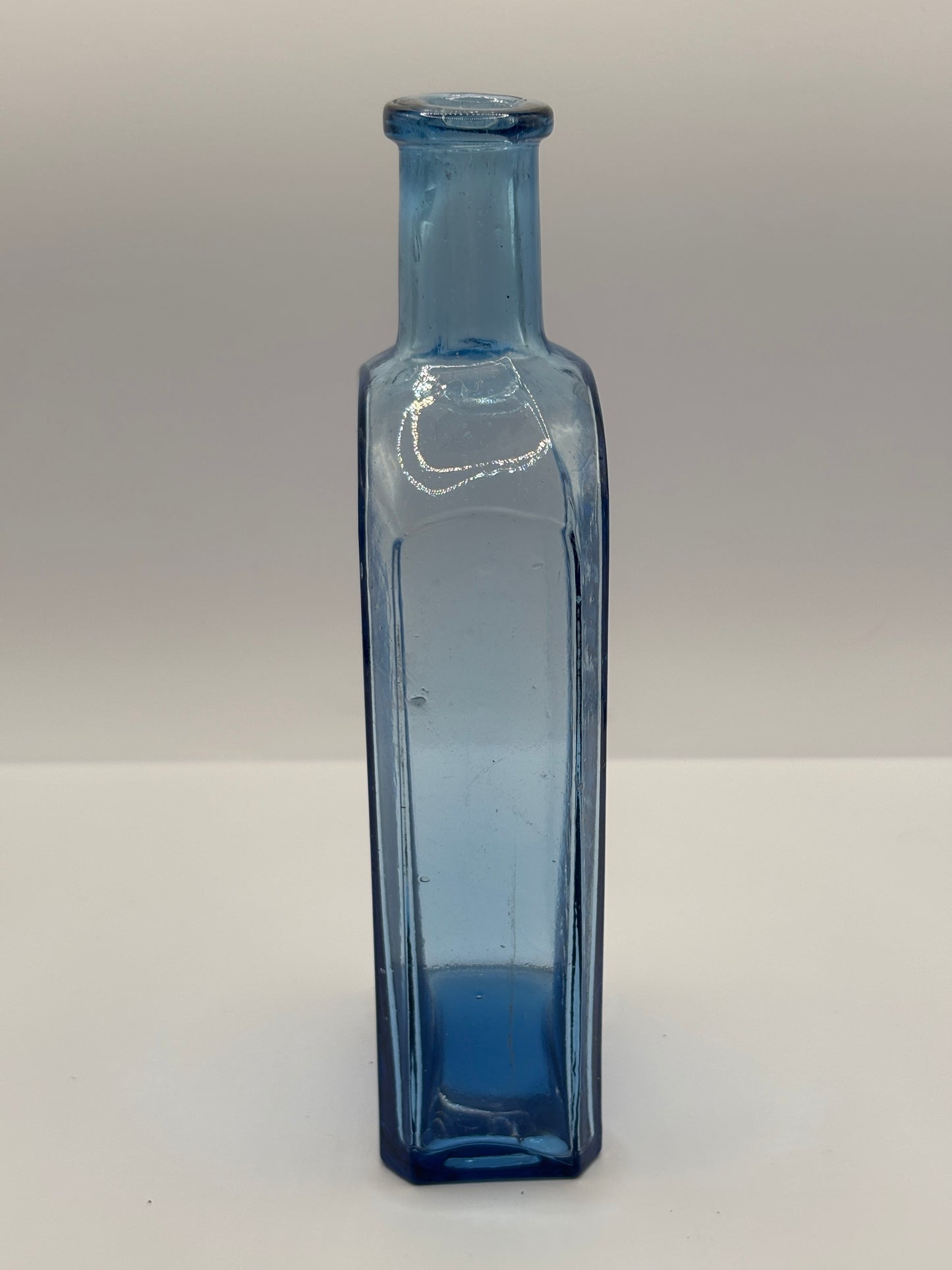 Old blue glass advertising chemist bottle, Owbridge Lung Tonic