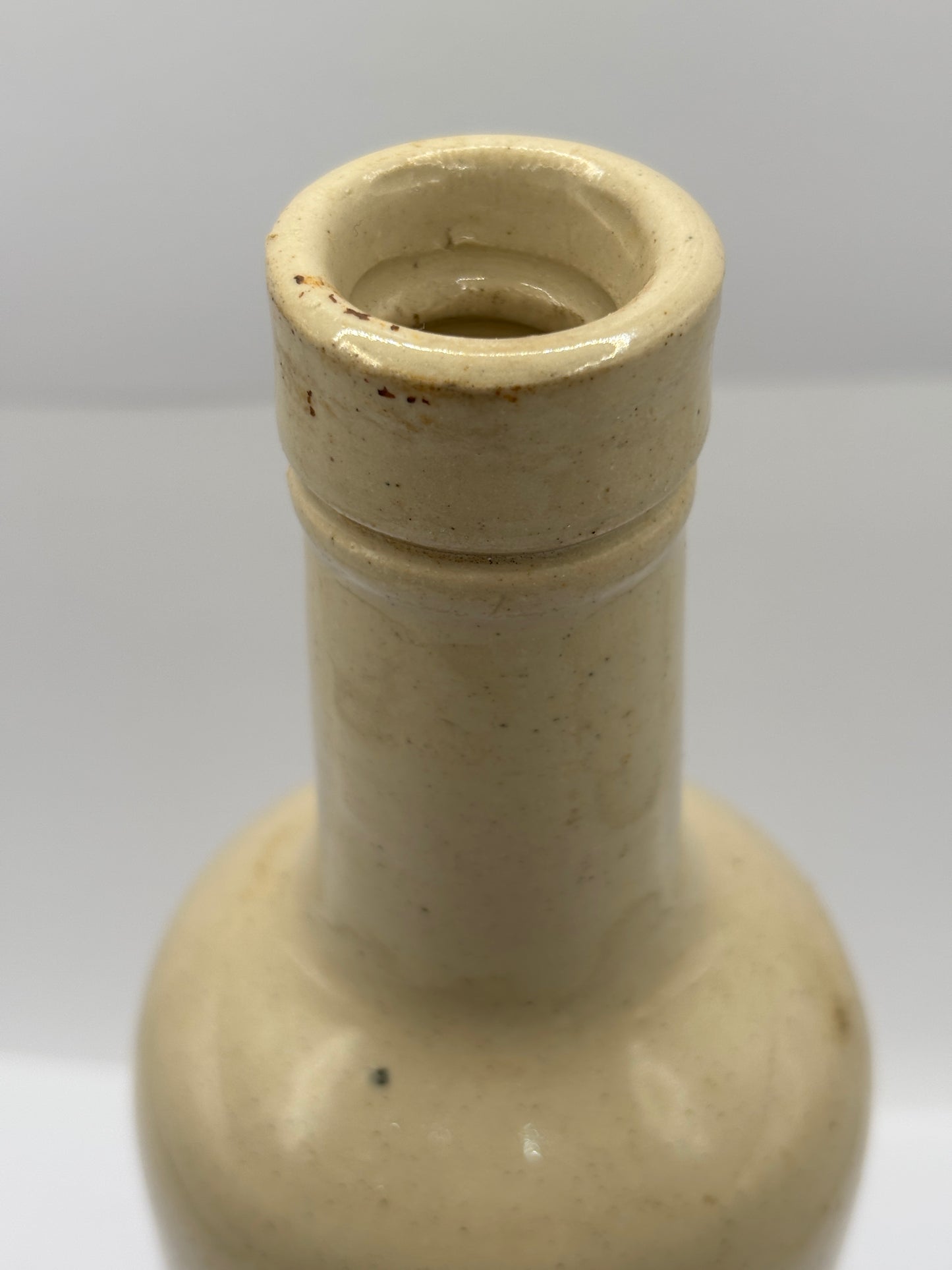 Old advertising stoneware bottle, Plynine household ammonia. Small size 21.5cms