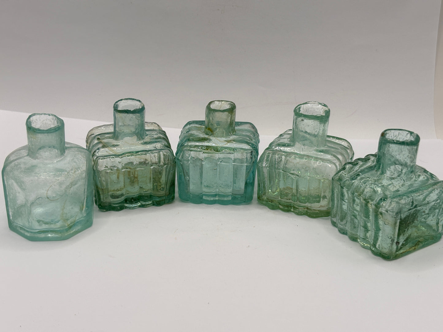 5 old aqua glass inks swirly inks, inkwells, ink bottles, penny ink.
