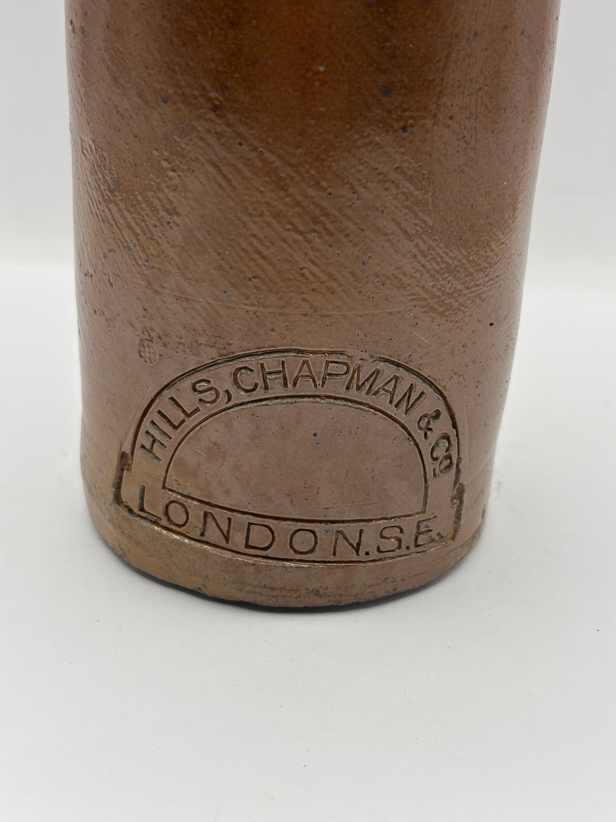 Old impressed stoneware ginger beer bottle, London. Hills chapman & co