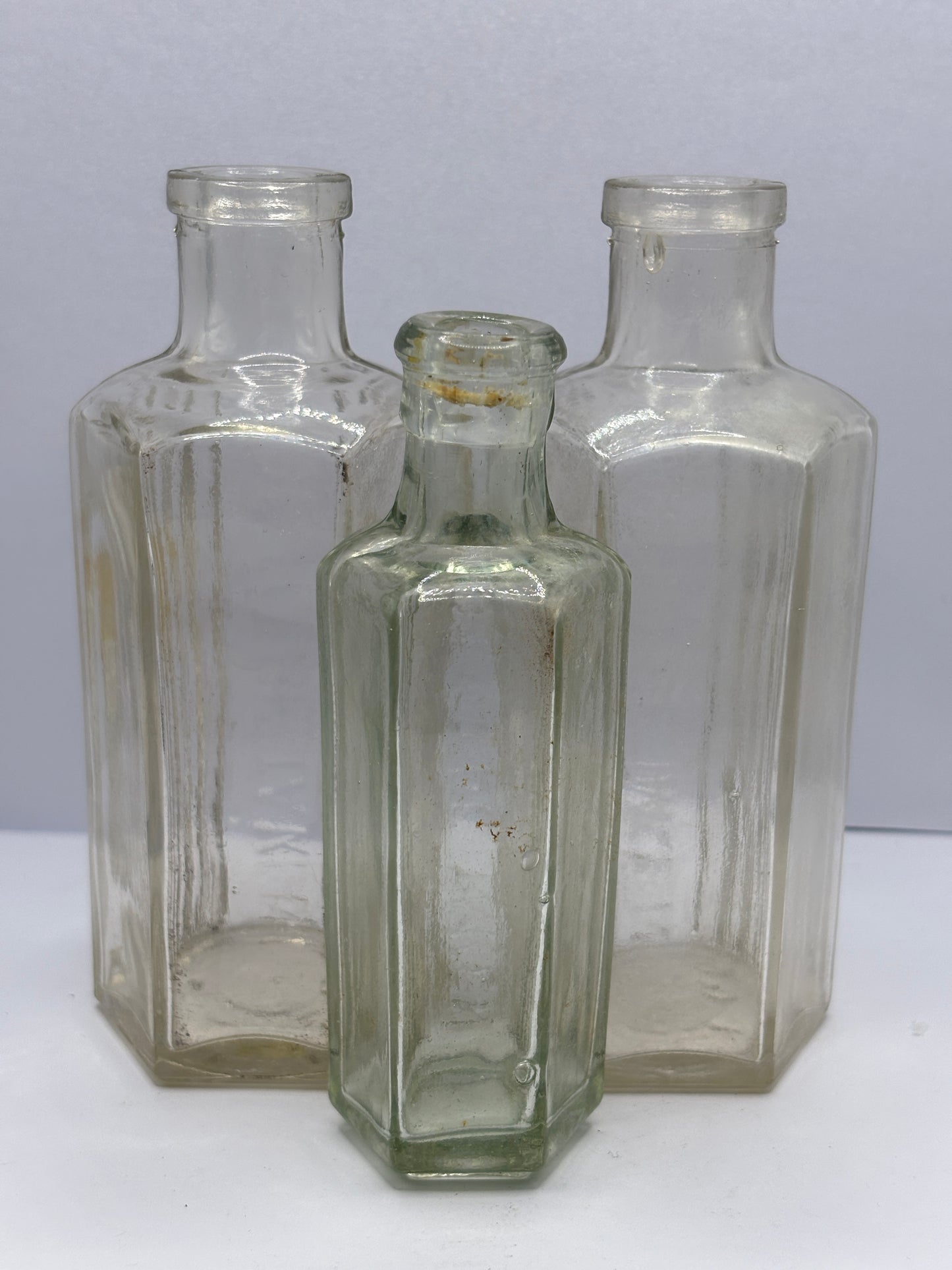 3 Old clear glass poison bottles, not to be taken