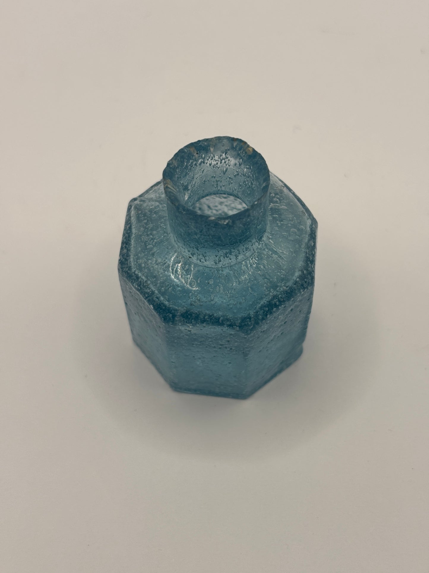 Old blue glass inkwell, ink bottle, penny ink. Lots of air bubbles