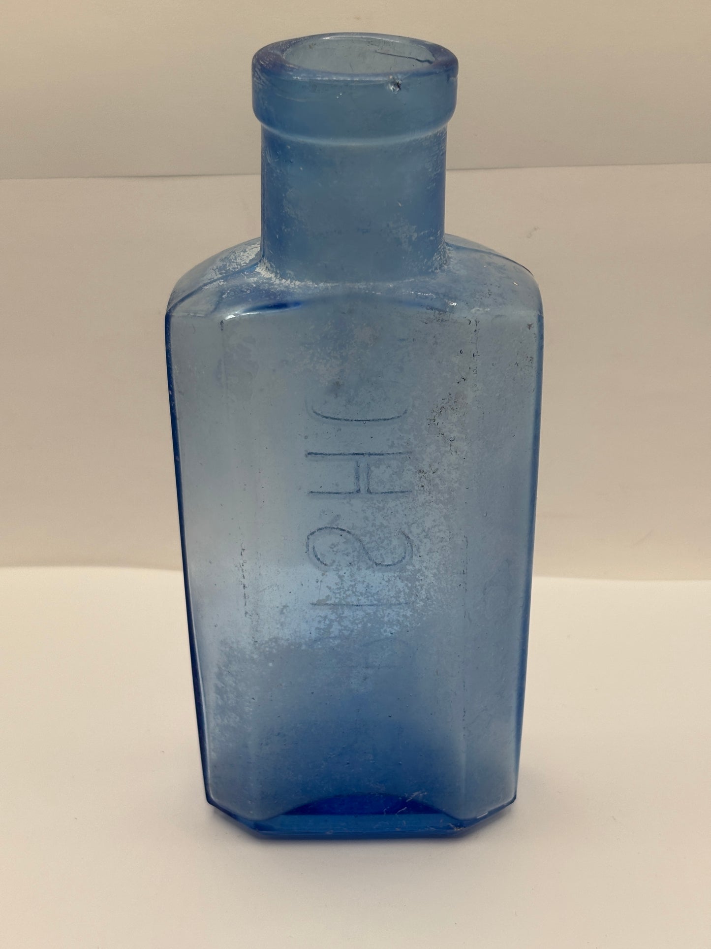 Old crusty blue glass advertising chemist bottle, Bishop