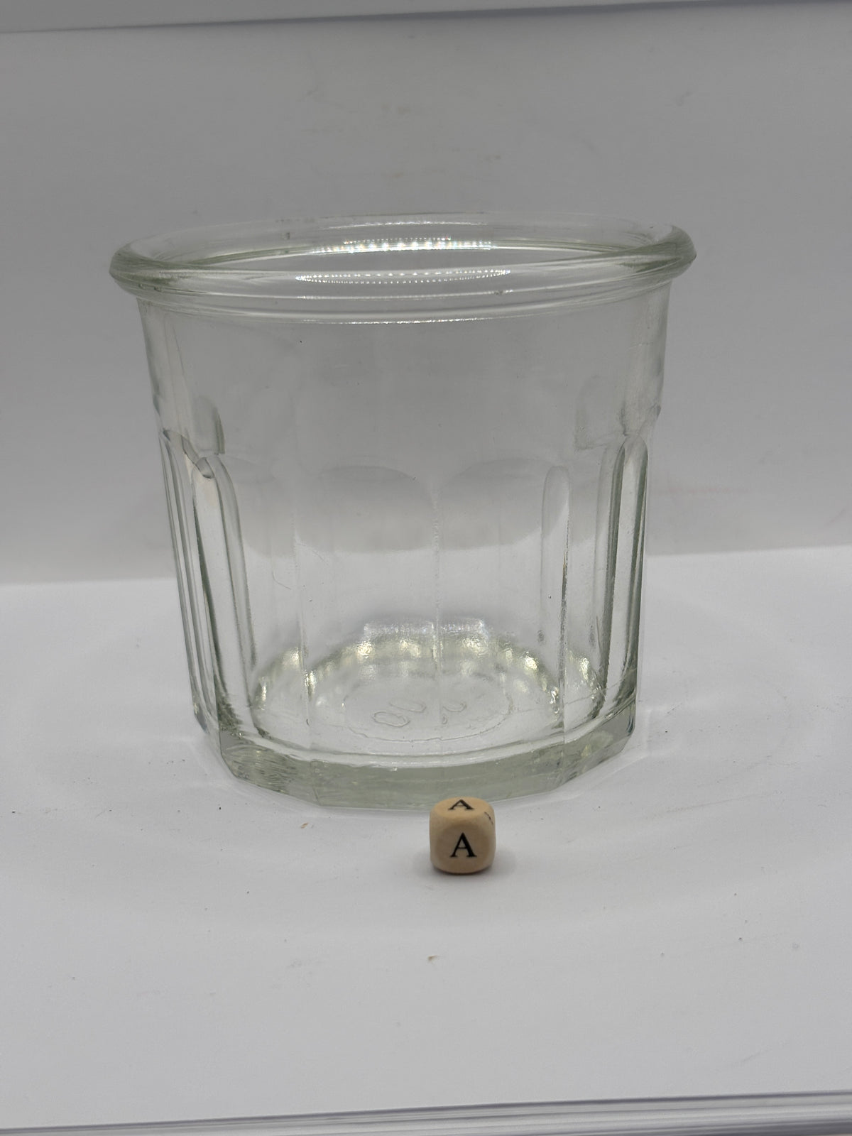Old clear glass French jam jar (a)