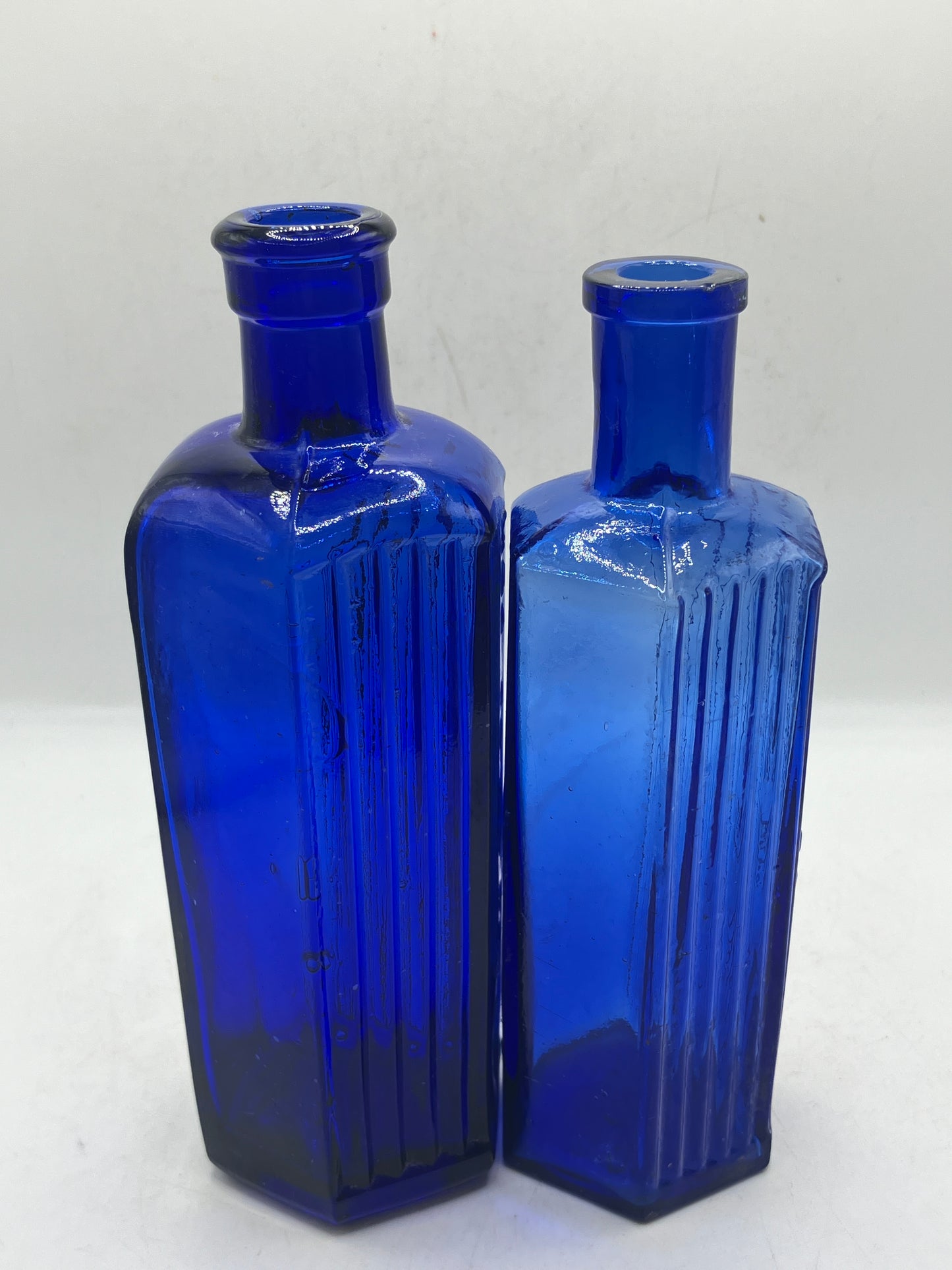 2 blue glass ribbed poison bottles, Not to be taken