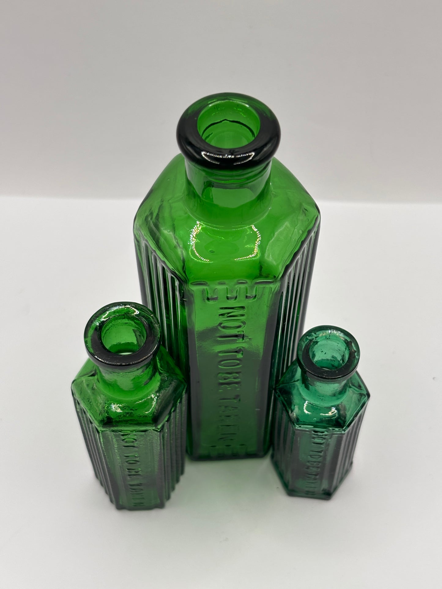 3 Old green glass poison bottles, not to be taken