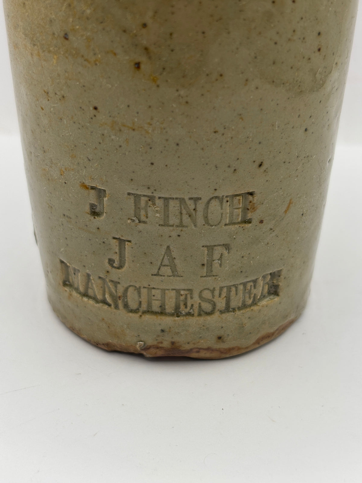 Old impressed stoneware ginger beer bottle, Manchester. J.Finch