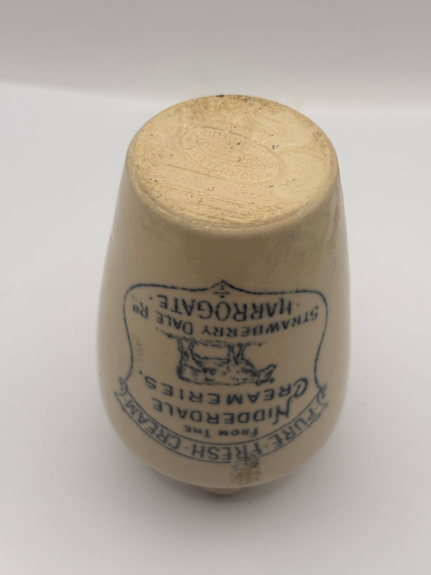 Old advertising cream pot, Nidderdale creameries. Pure fresh cream. Cow print