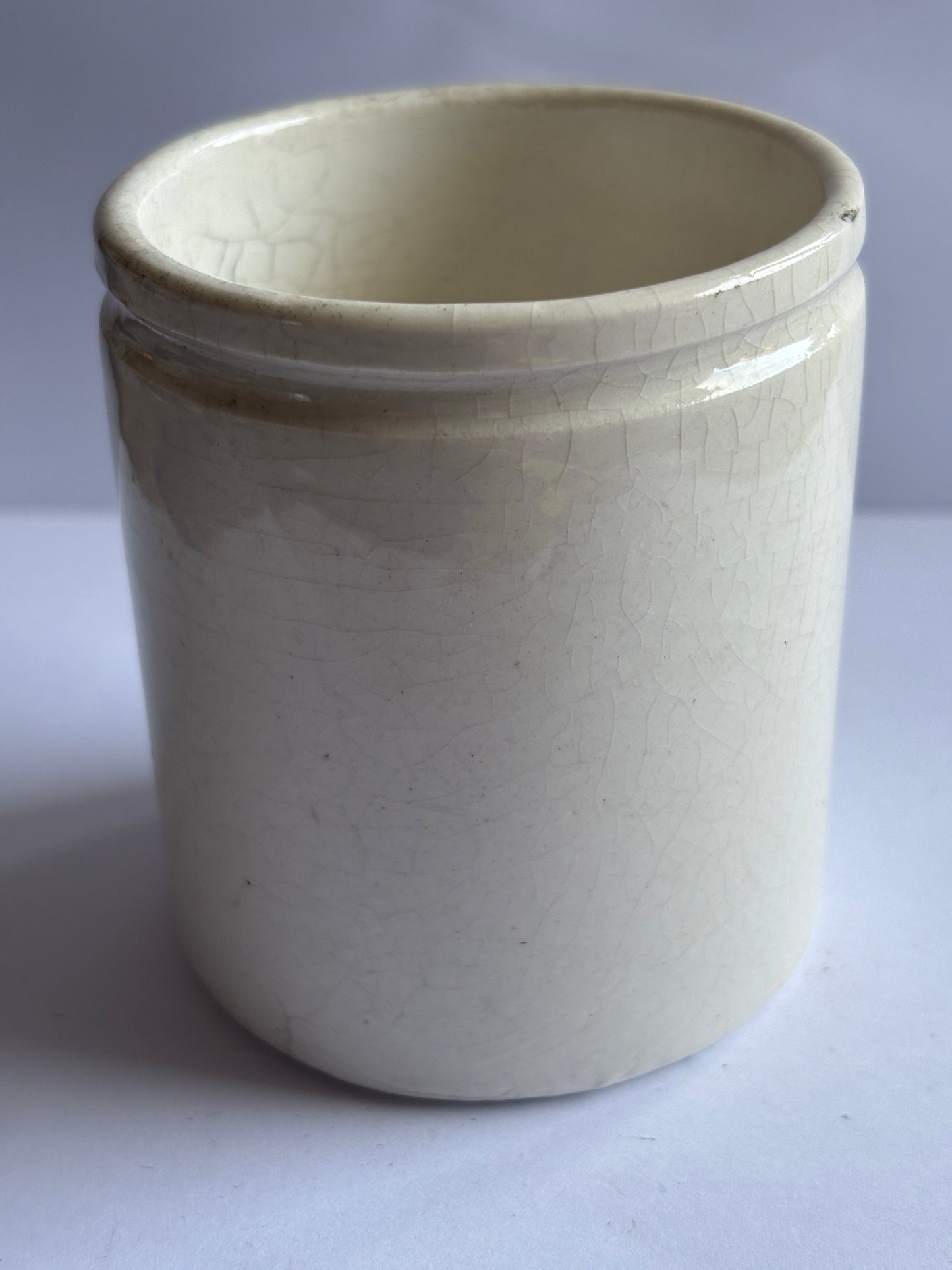 Old white stoneware pot
