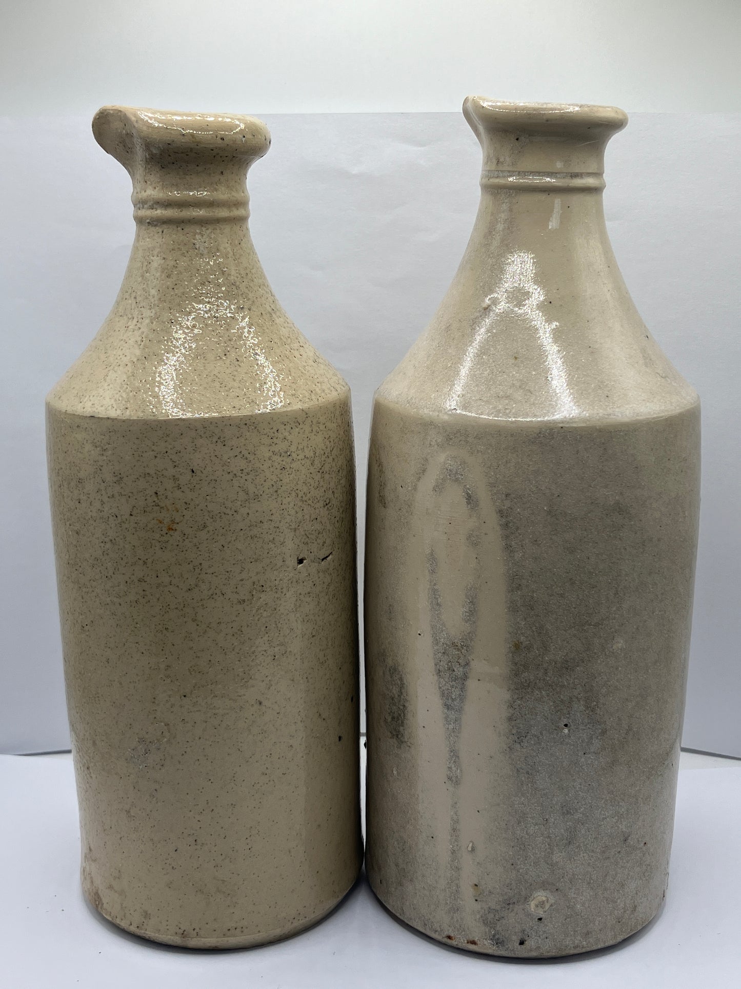 2 tall white stoneware pouring ink bottles