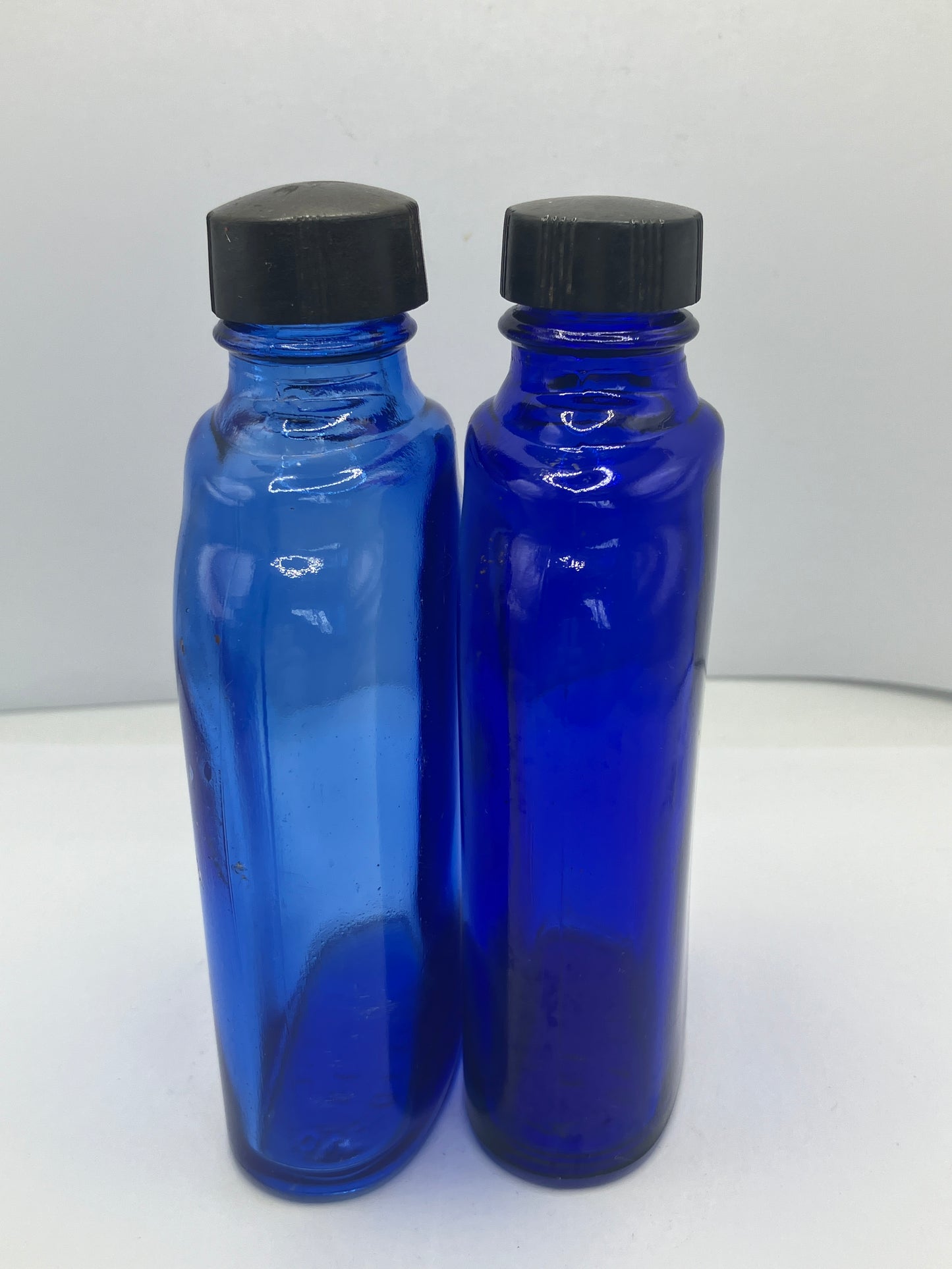 2 blue glass optrex bottles