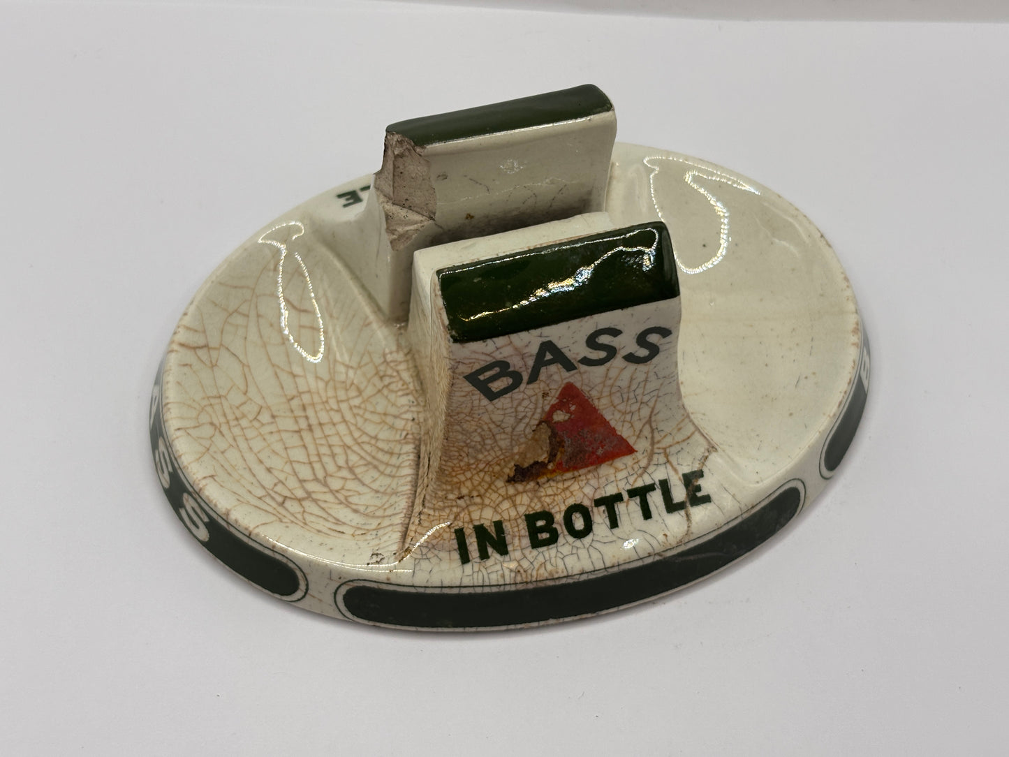 Old stoneware match striker. Bass bottled beer. Damages