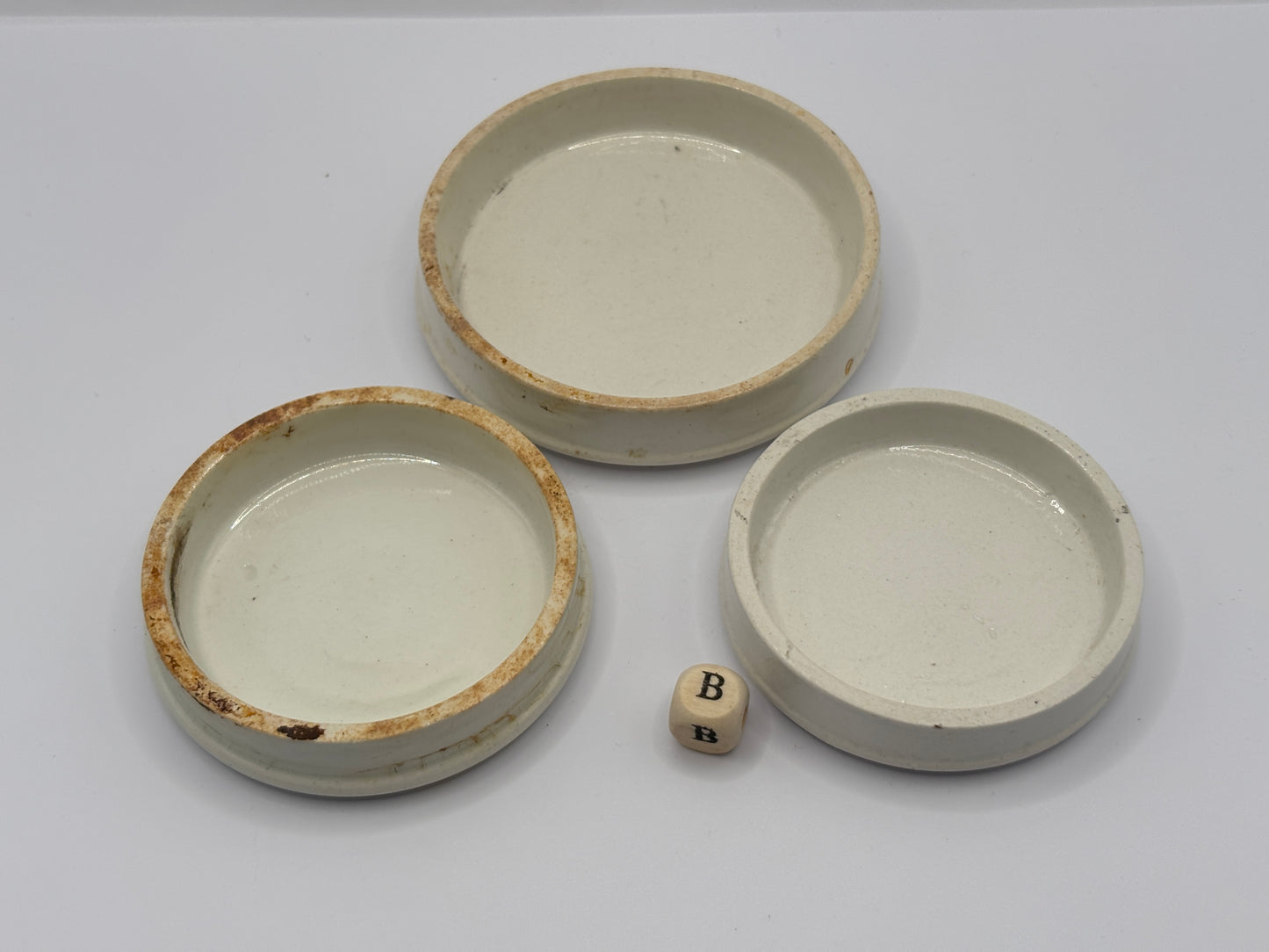 3 old plain stoneware lids (B)