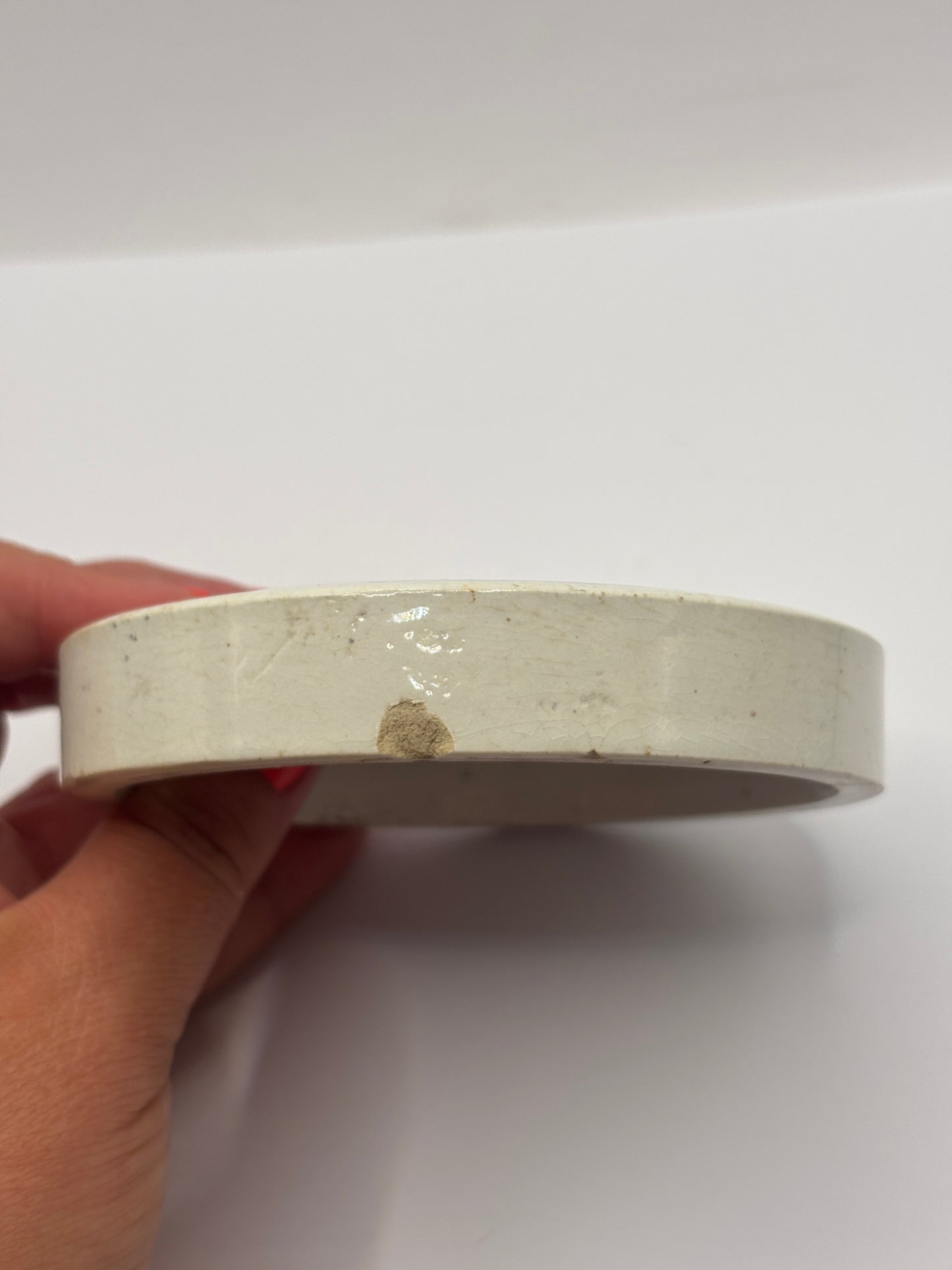 Old early advertising lid, large Burgess anchovy paste. Repaired