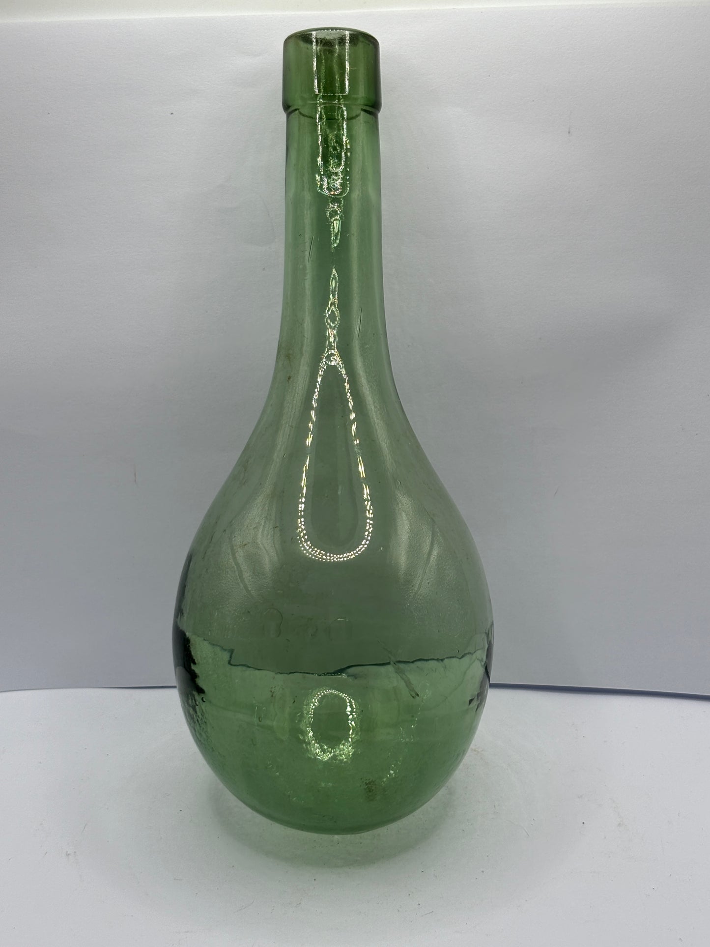 Old round bottom aqua glass bottle