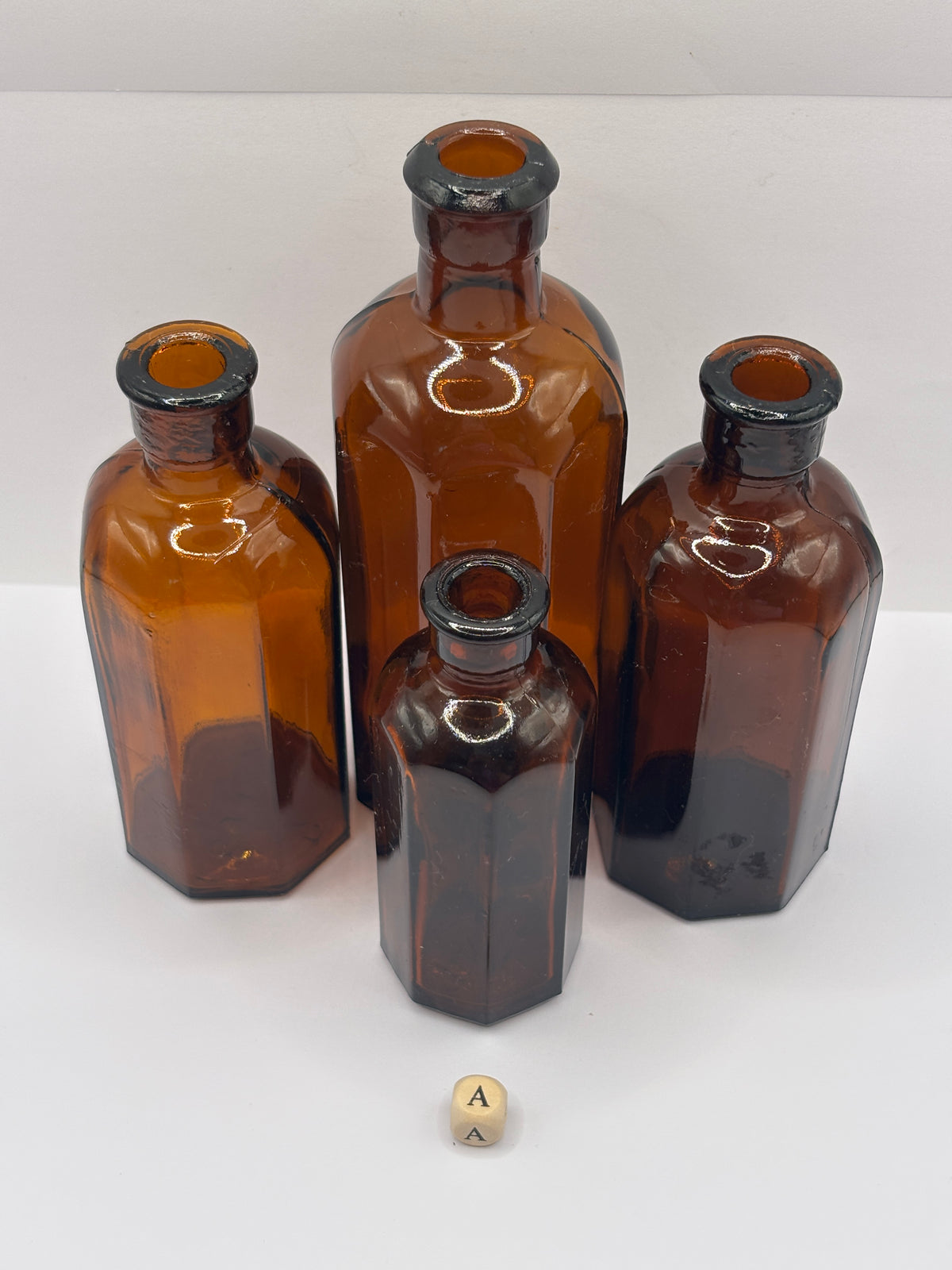 4 Old amber glass medicine bottles (A)