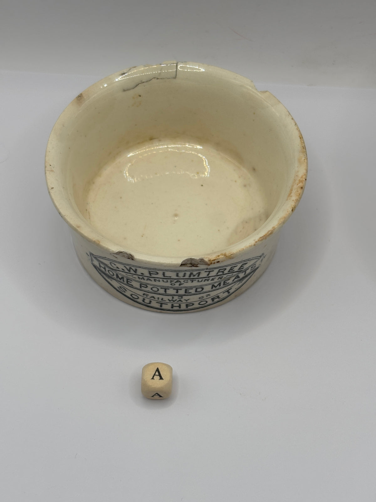 Old advertising meat paste pot, Plumtree home potted meats. Damaged (a)