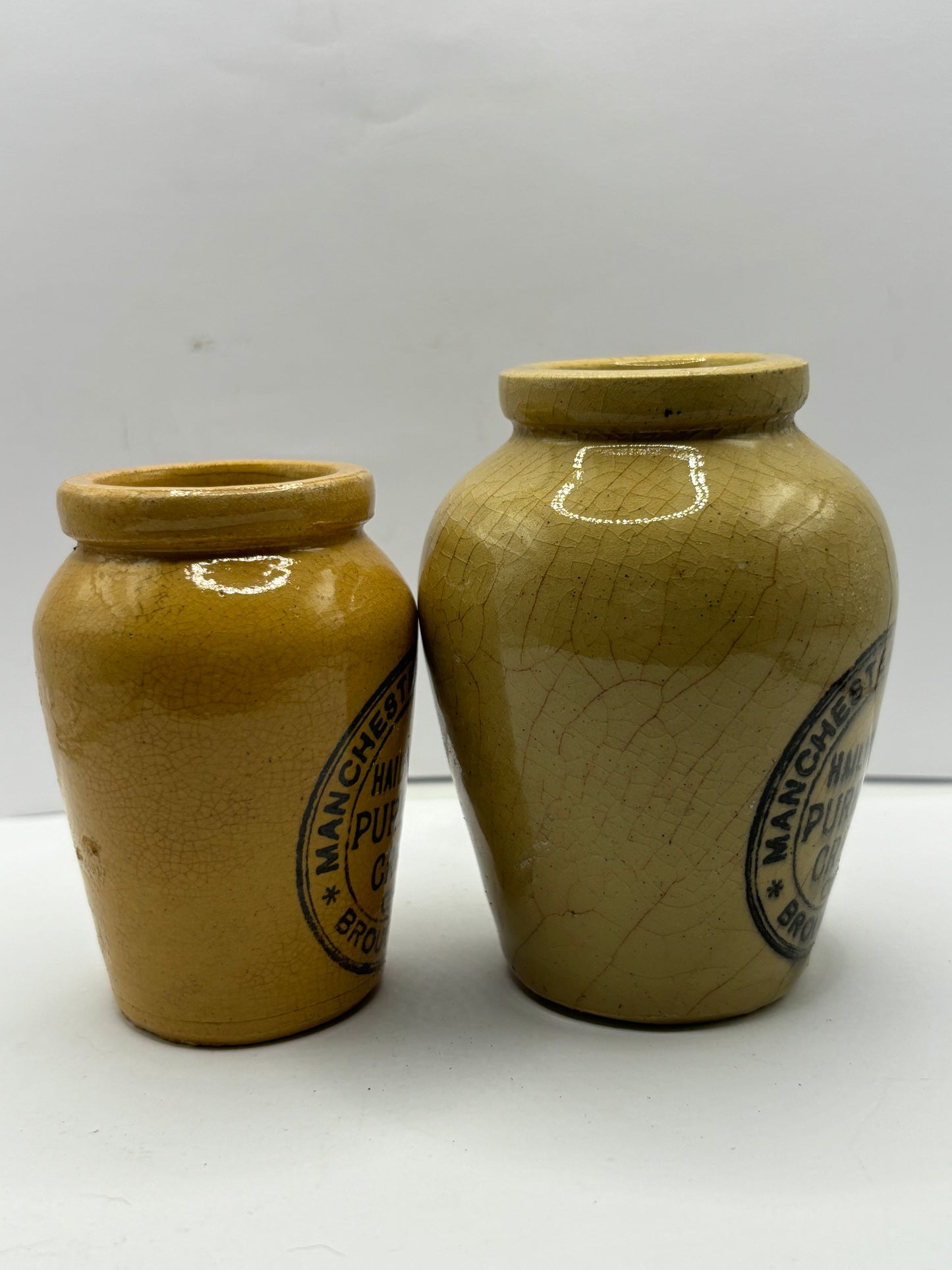 2 advertising cream pots, Stained & crazed