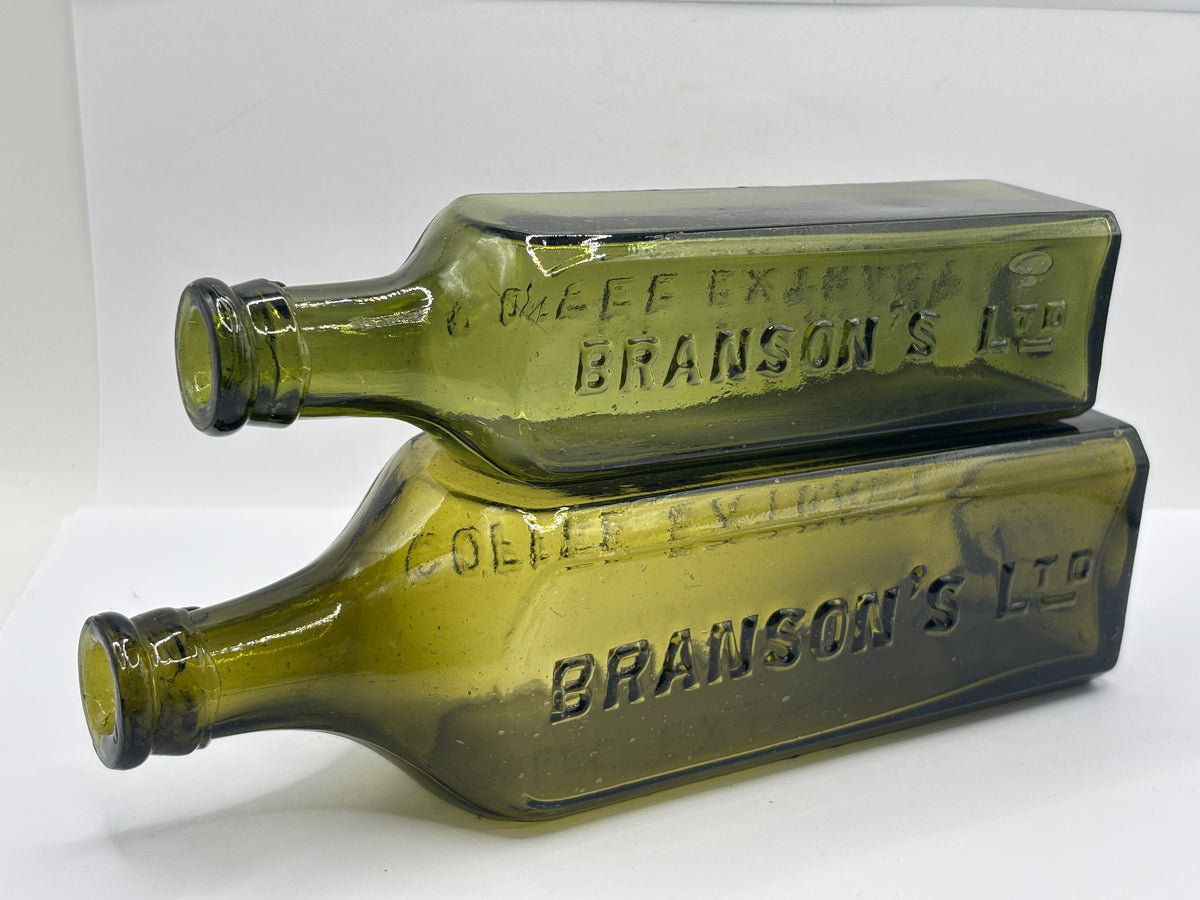 2 Old green glass Branston sauce bottles