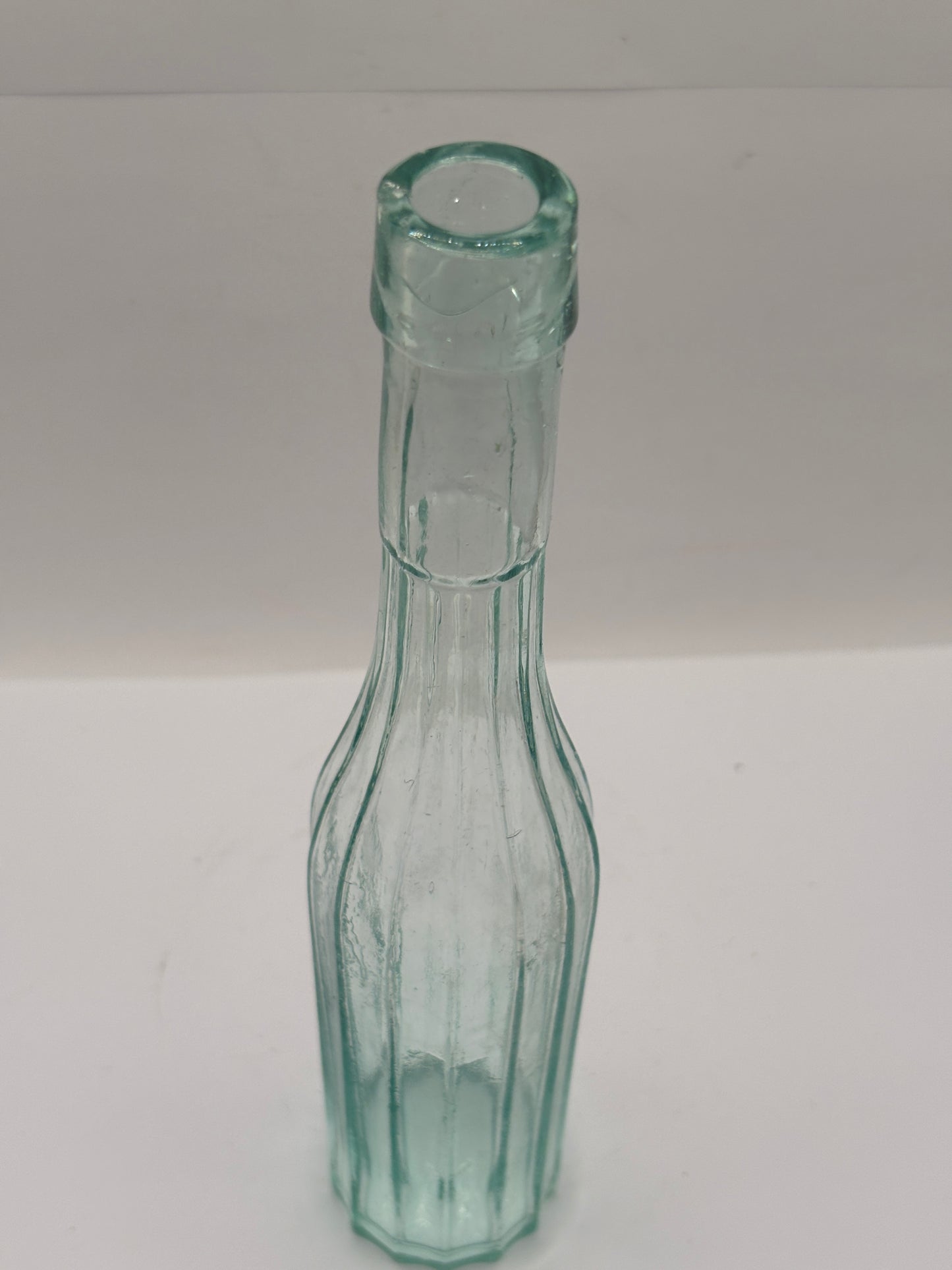 Old aqua glass bottle, vinegar?