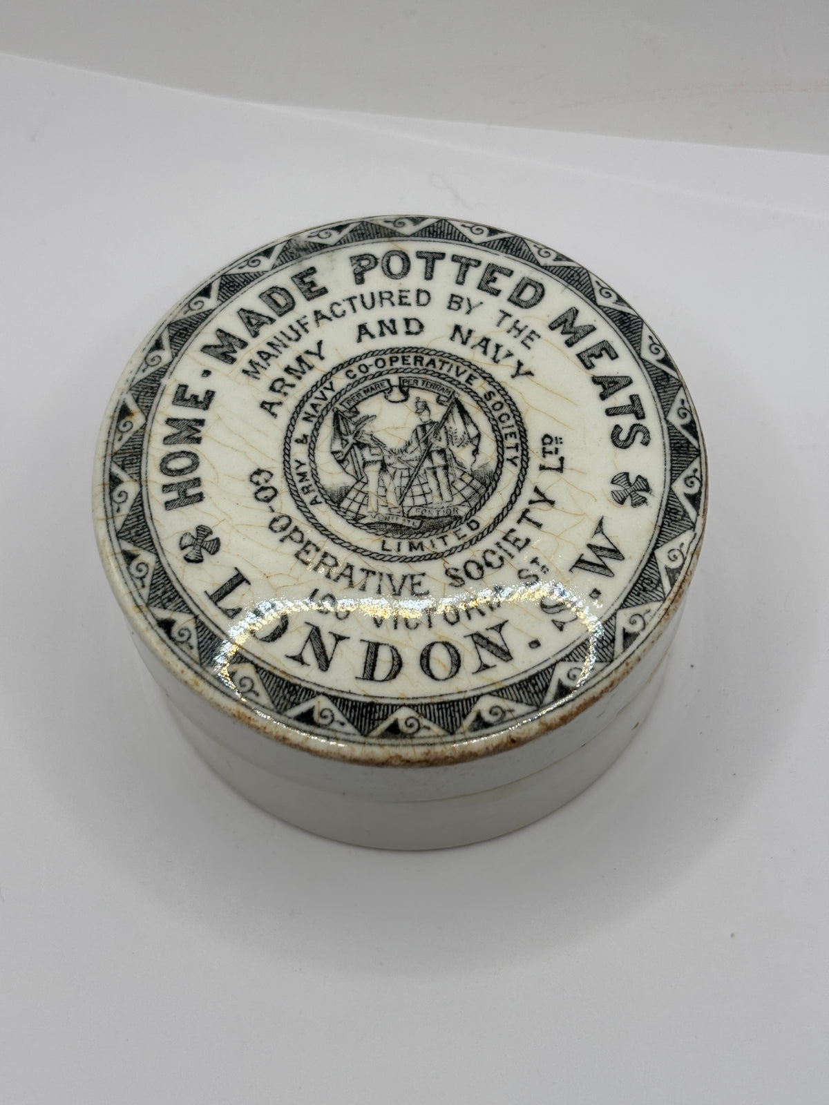 Old advertising lid and base. Army & Navy cooperative society home made potted meats