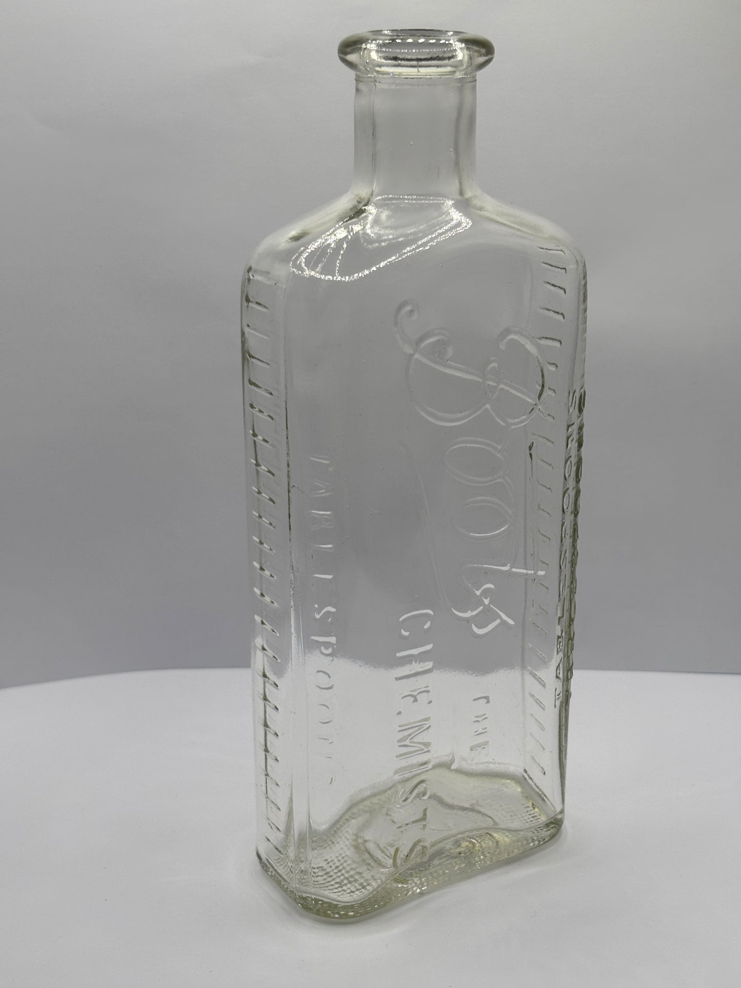 Old clear glass Boots chemist bottle