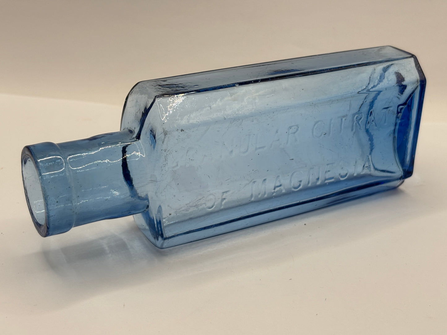 Old blue glass advertising chemist bottle, Granular citrate of magnesia
