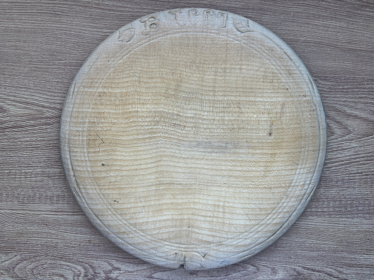 Old wooden carved bread board