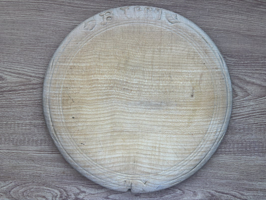 Old wooden carved bread board