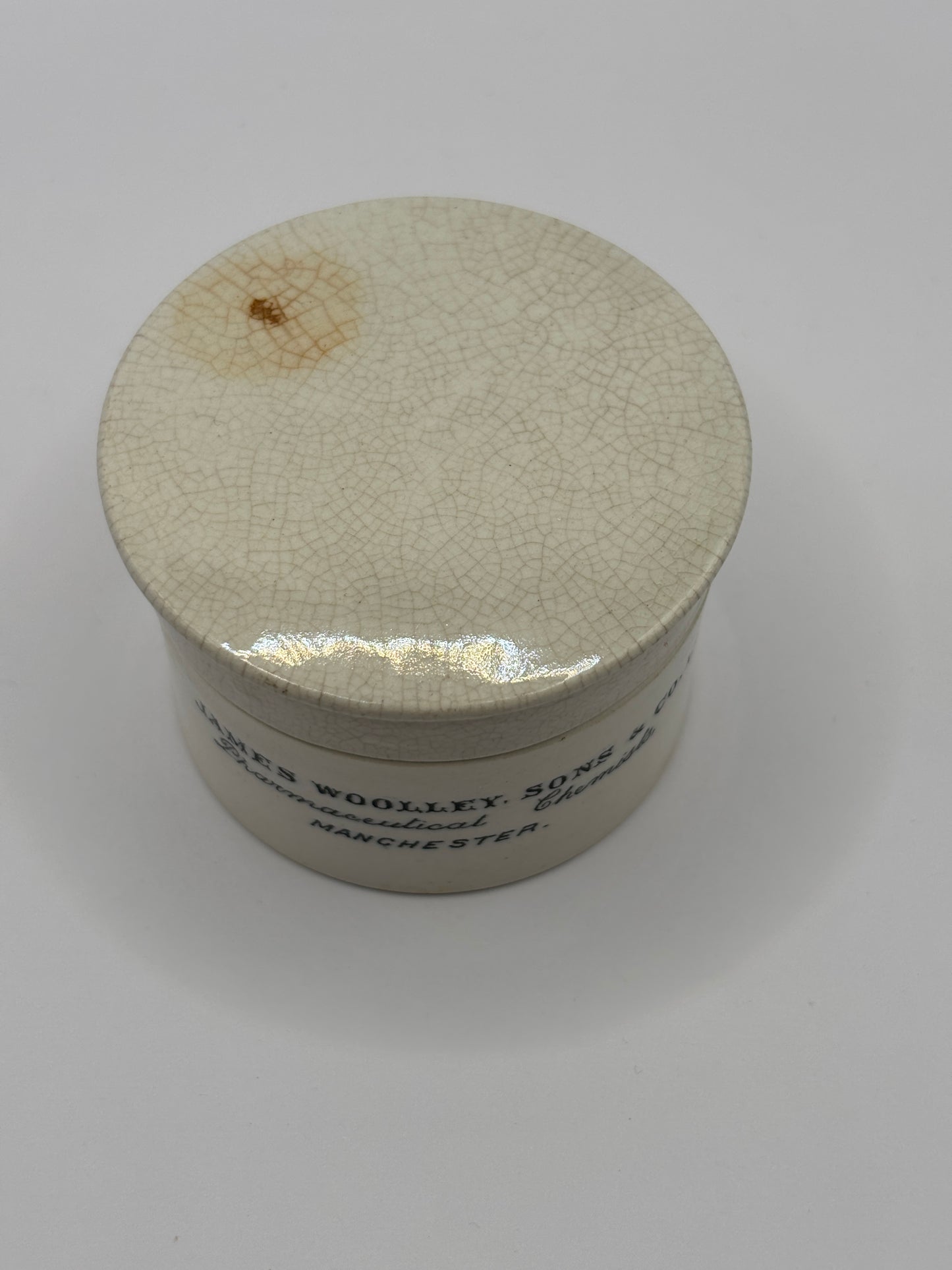 Old advertising chemist lid and base. James Woolley pharmaceutical chemist