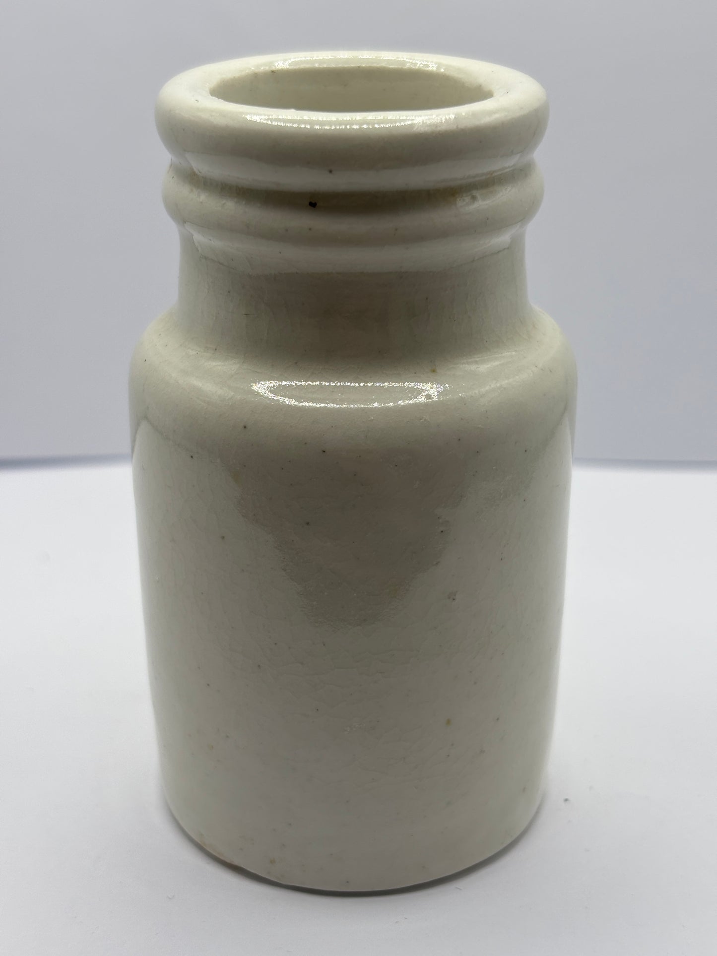 Old white stoneware jar