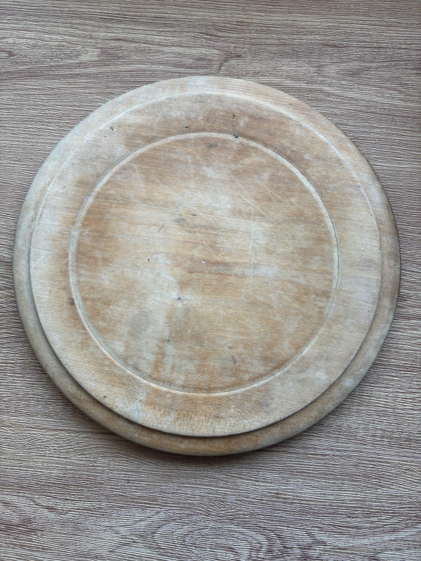 Old wooden carved bread board